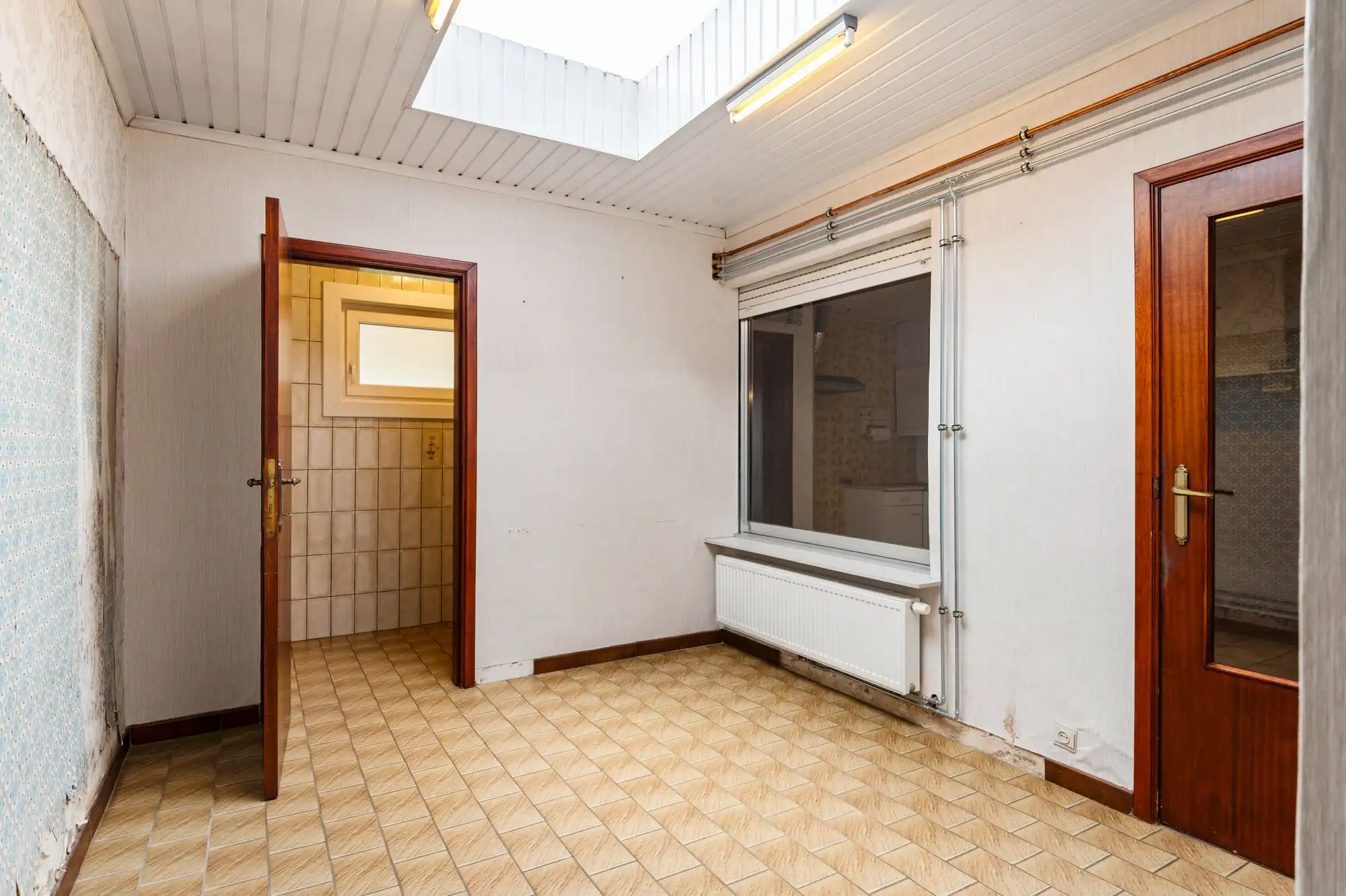 Te renoveren gezinswoning met leuke tuin en 2 garages op topligging in Brasschaat! foto 14