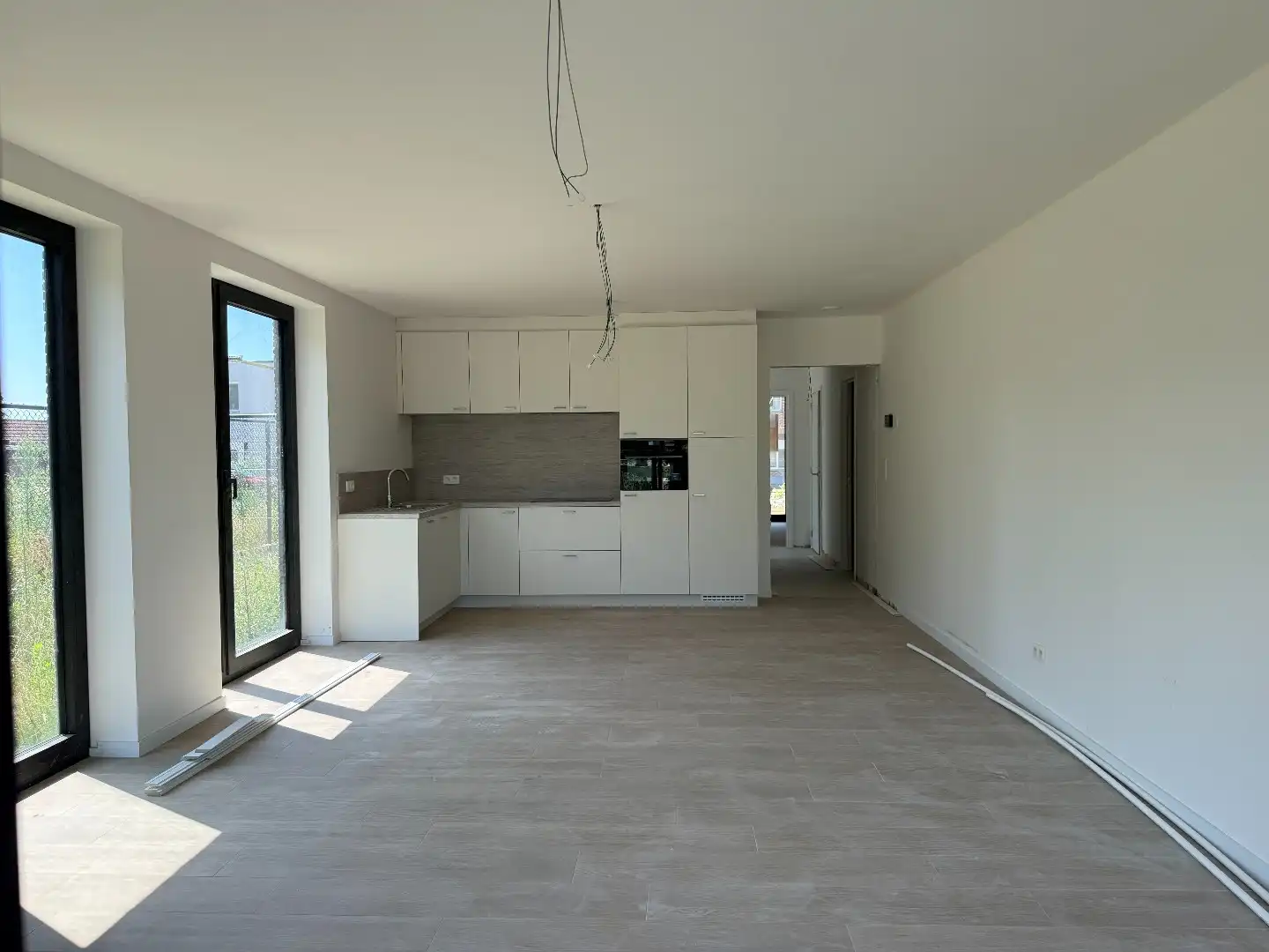 Laatste gelijkvloers 2-slpk appartement met tuin, 1 stpls en een kelder foto 8
