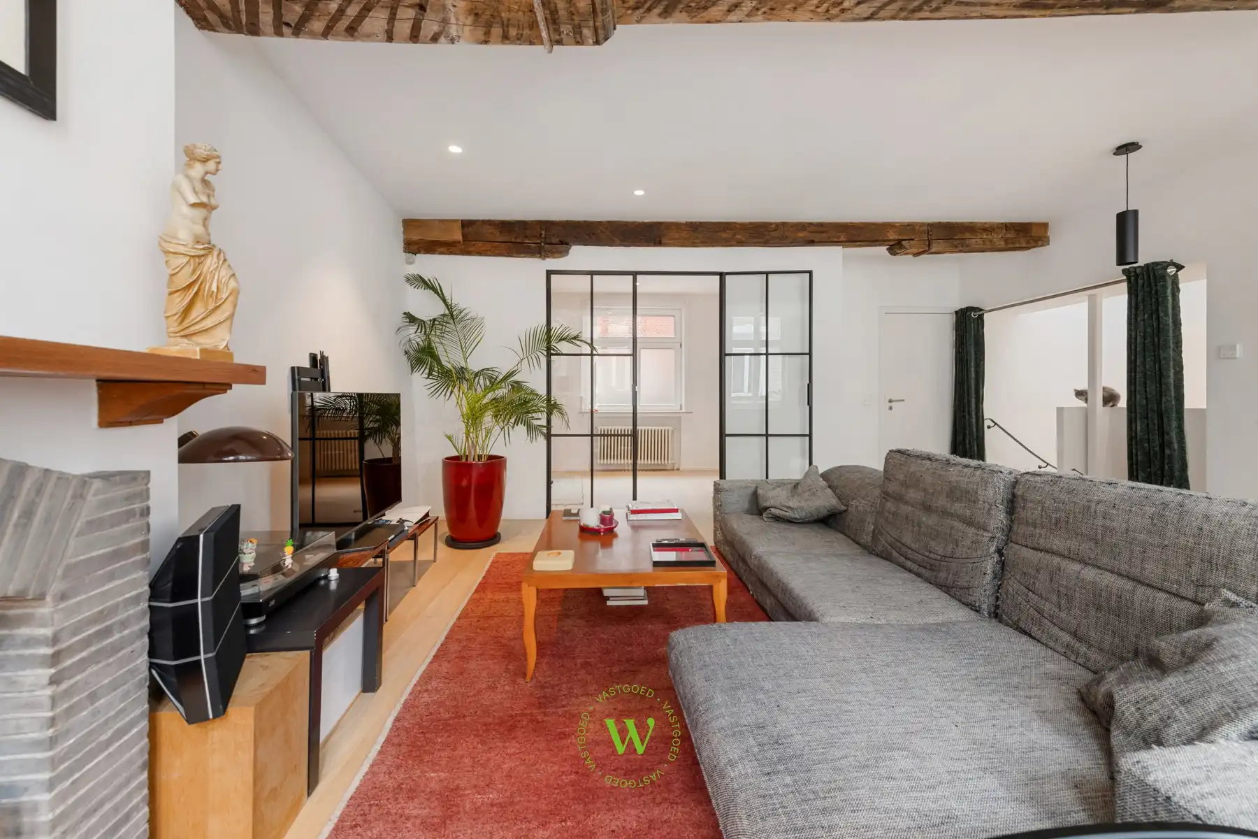 Unieke bel-étagewoning in het hart van Brugge. foto {{pictureIndex}}