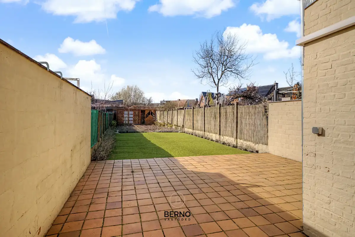 Rijwoning met ruime garage en zongerichte tuin. foto 20