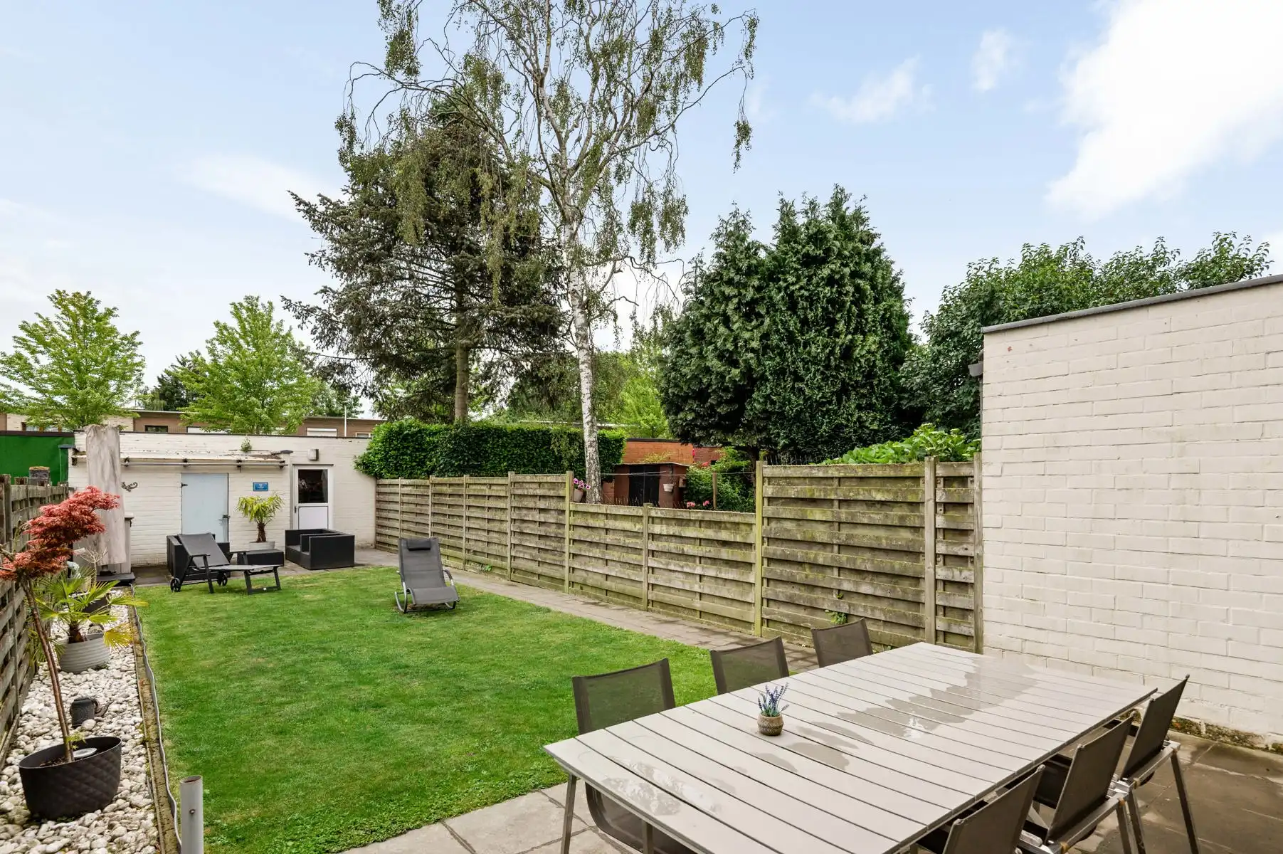 Gelijkvloers wonen met twee achterliggende garageboxen + oprit foto 4