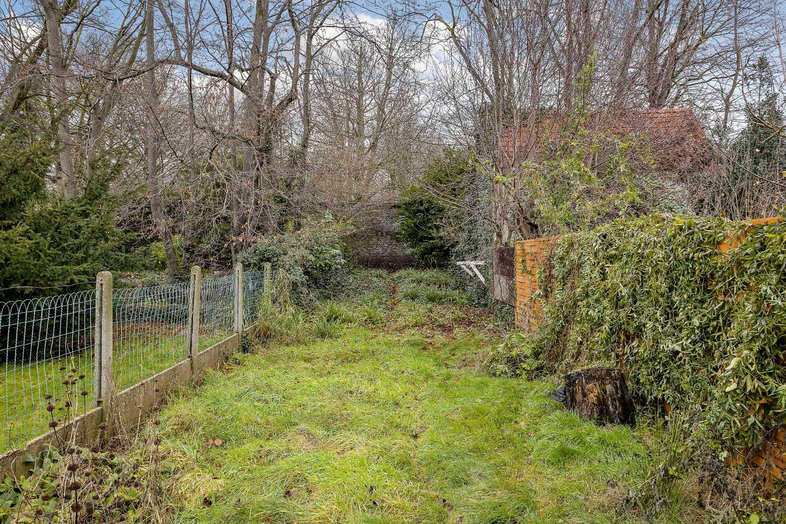 Te renoveren opbrengsteigendom met twee appartementen, parkings en tuin foto 24