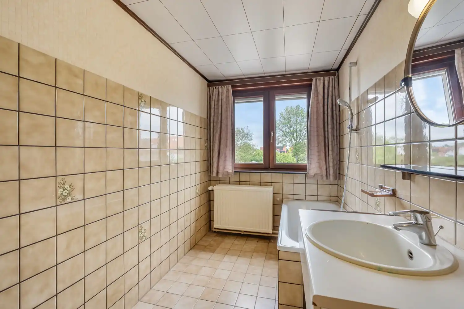 Goed gelegen woning met 4 slaapkamers, een garage en een diepe tuin in een verkeersluwe straat te Kessel-Lo! foto 20