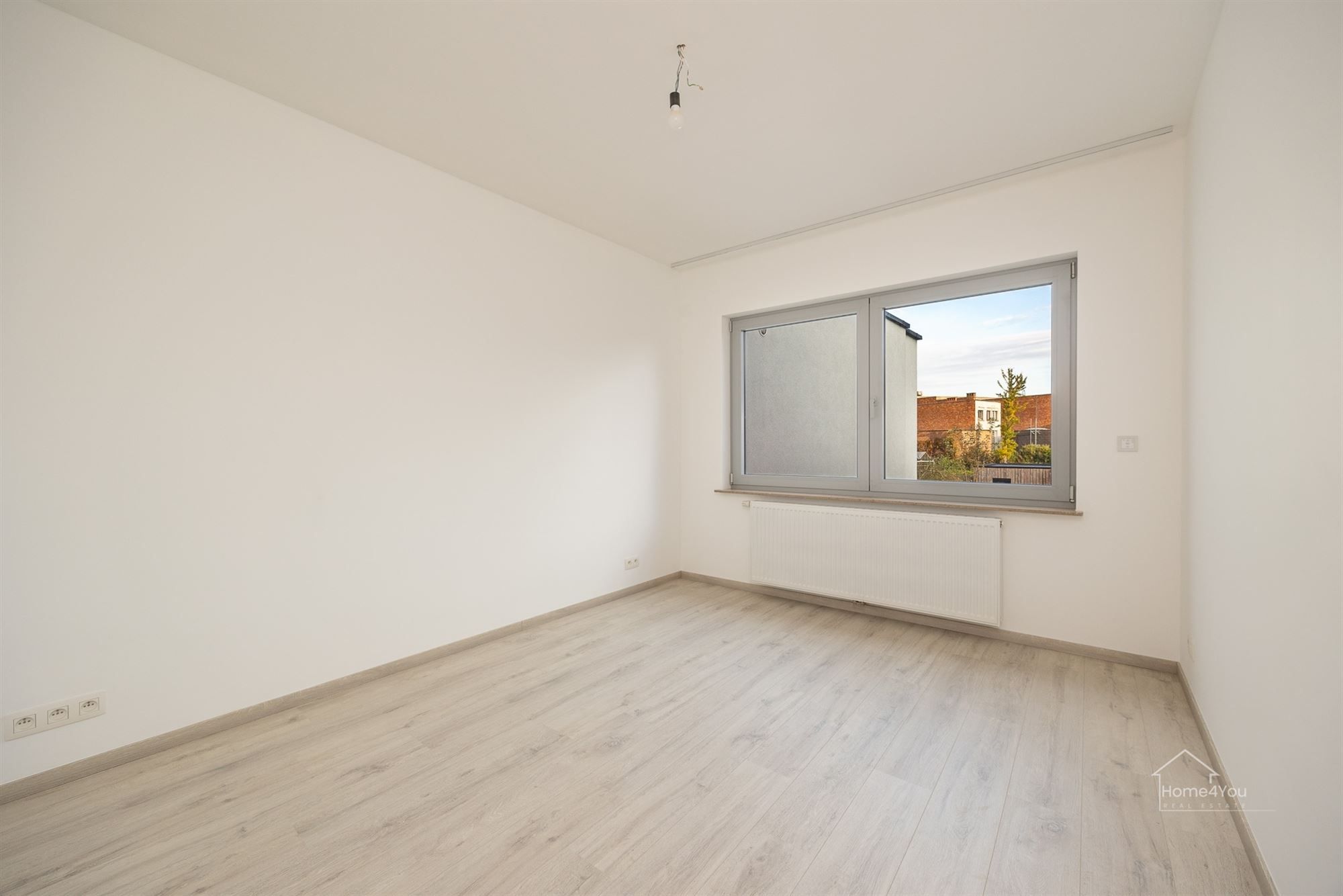 Vernieuwd en zonnig 2 slaapkamer appartement foto 12