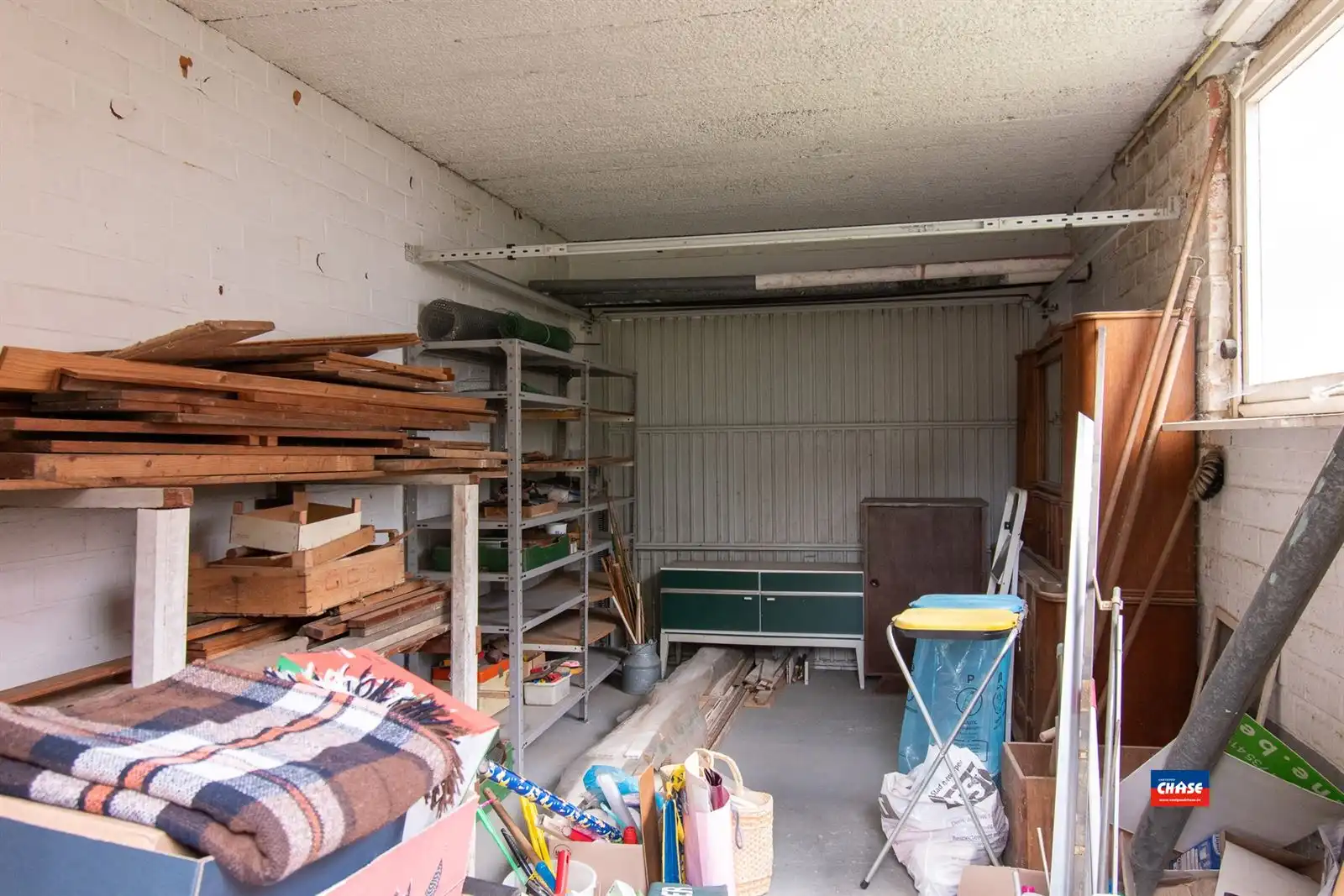 Halfopen bebouwing met 3 slaapkamers, tuin + 3 garageboxen foto 12