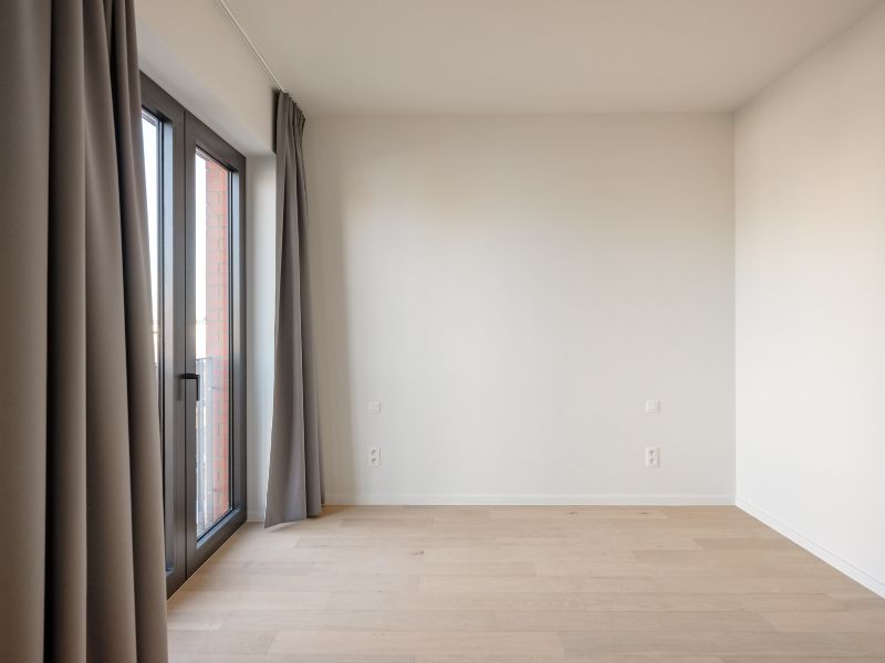Ruim 2slpk-appartement met zuid-west georiënteerd terras aan de ‘Nieuwe Dokken’. Een appartement met een fenomenaal zicht over het water en de Gentse skyline! foto 8