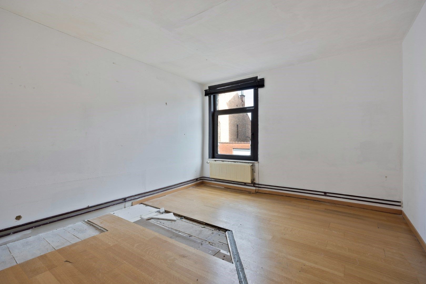 Halfopen hoekwoning met garage en dakterras op toplocatie in Kessel-Lo – renovatieproject met veel potentieel foto 26