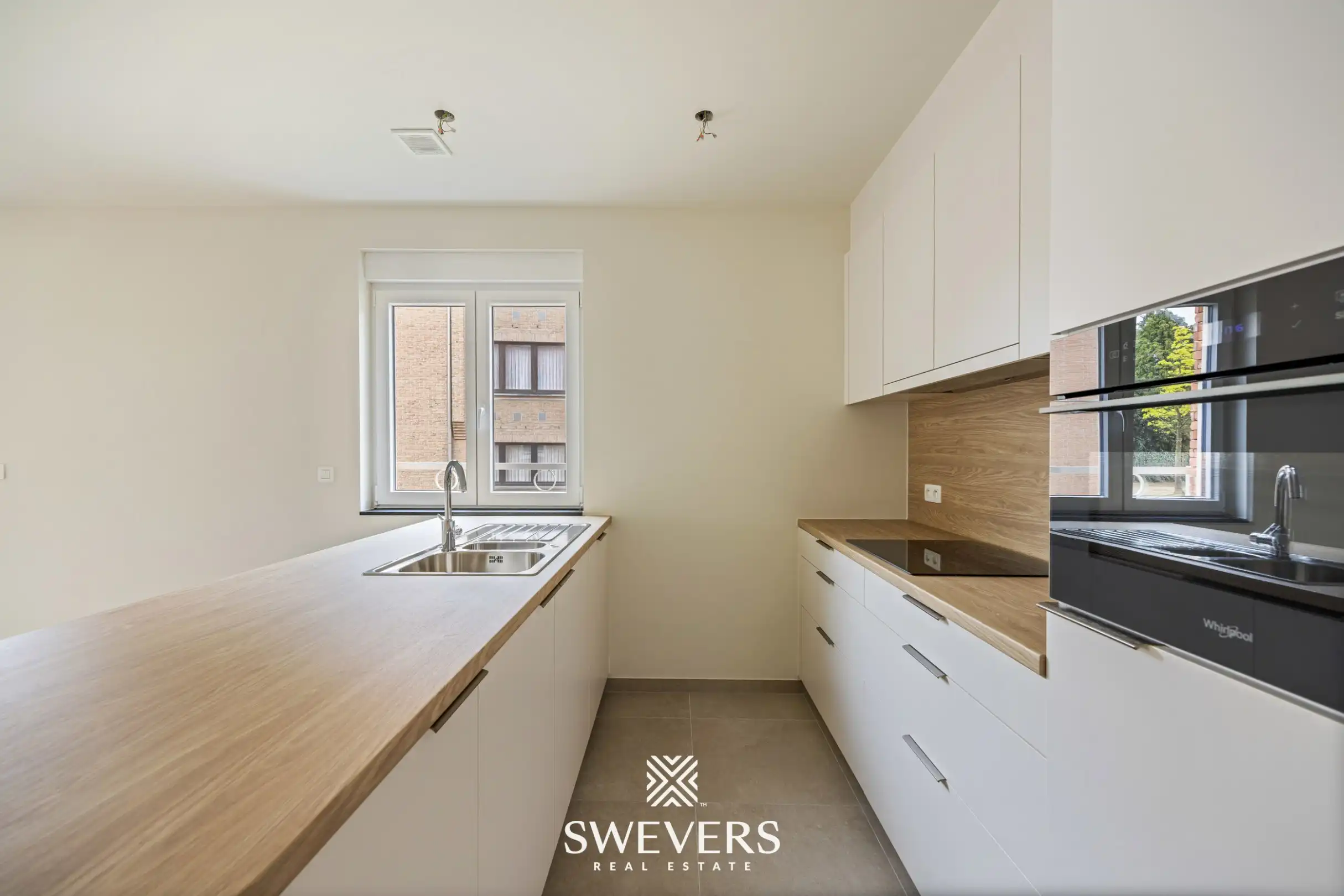 Modern gelijkvloers appartement met privétuin en dubbele parking foto 6