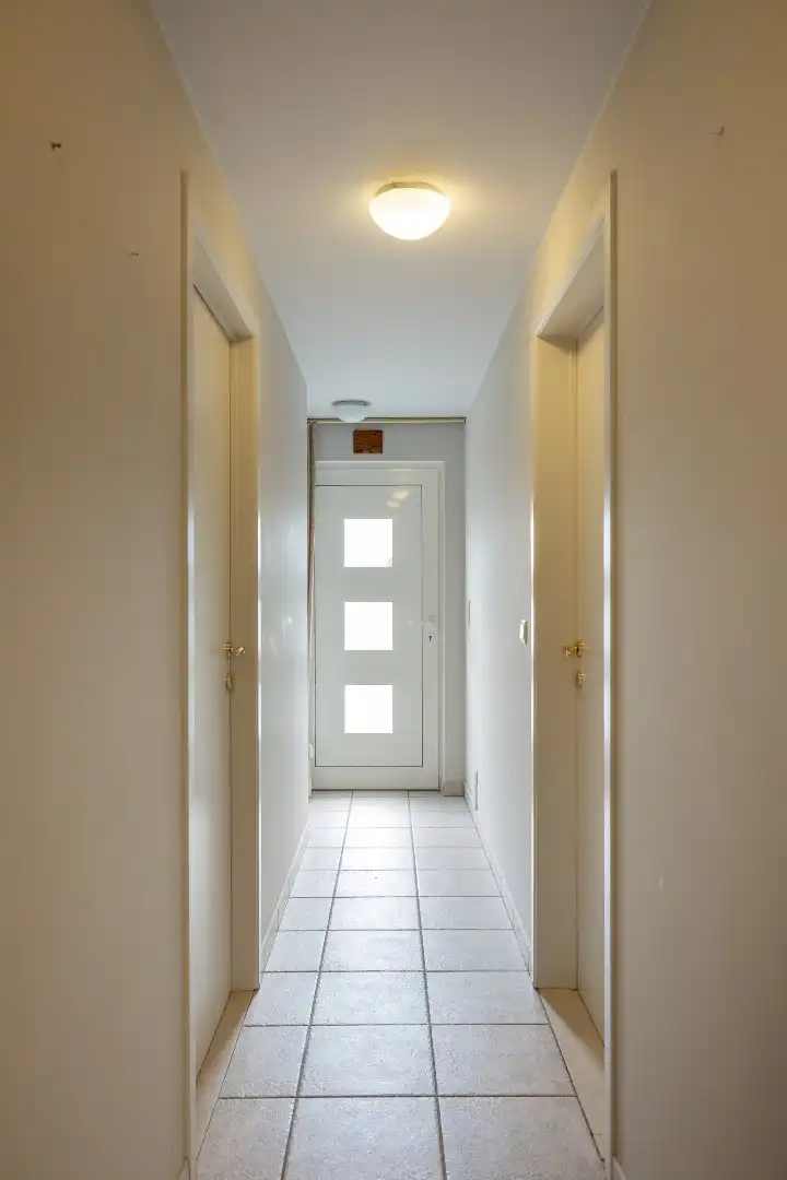 Ruim gelijkvloers appartement met terras en 2 slaapkamers te Overpelt centrum. foto 11