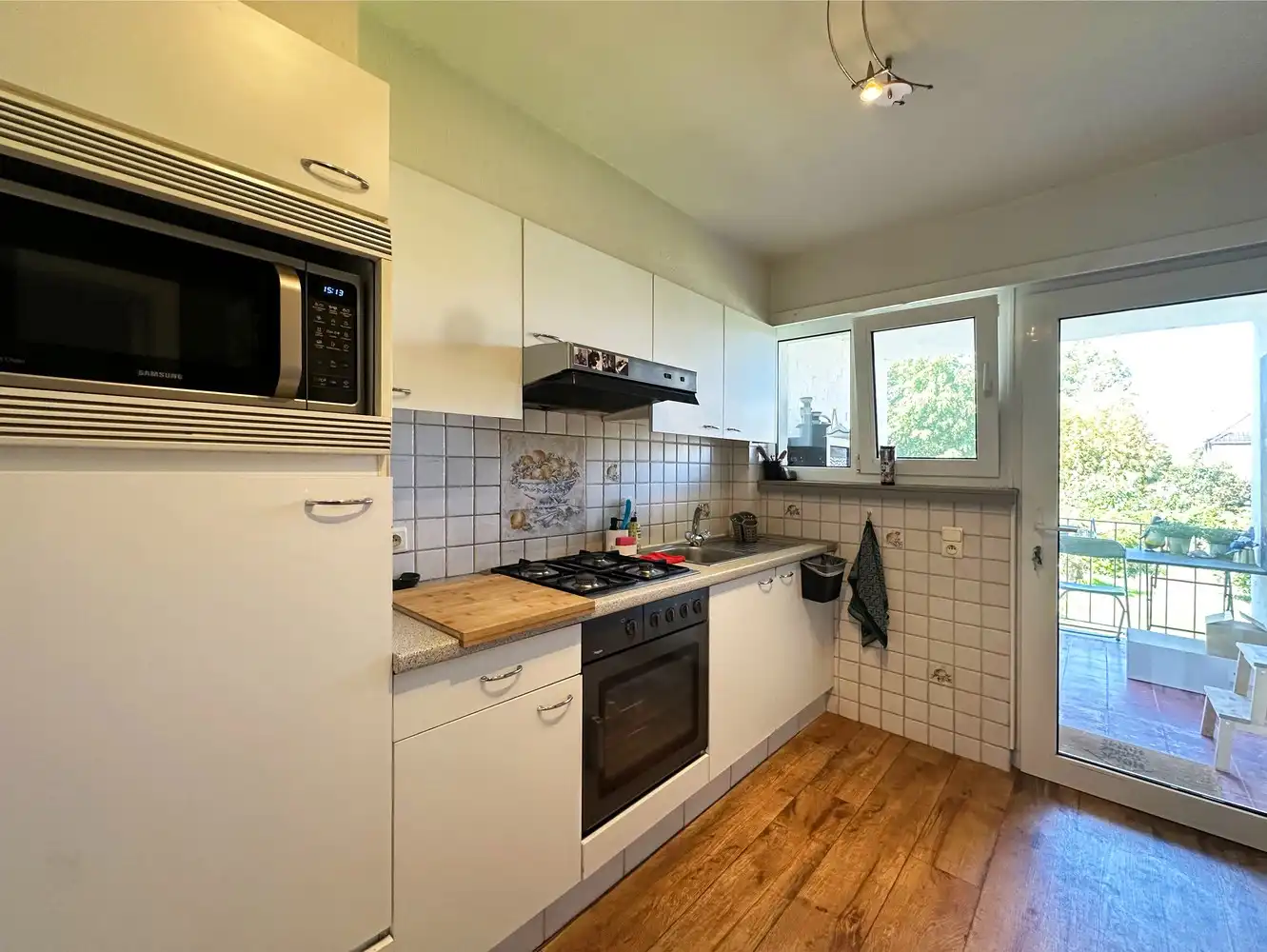 Verzorgd appartement met twee slaapkamers, inpandige garage, terras én tuin te Borsbeek! foto 4