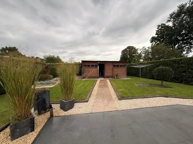 Halfopen woning met 3 slaapkamers, inpandige garage en mooie tuin in Kleine Brogel. foto 33