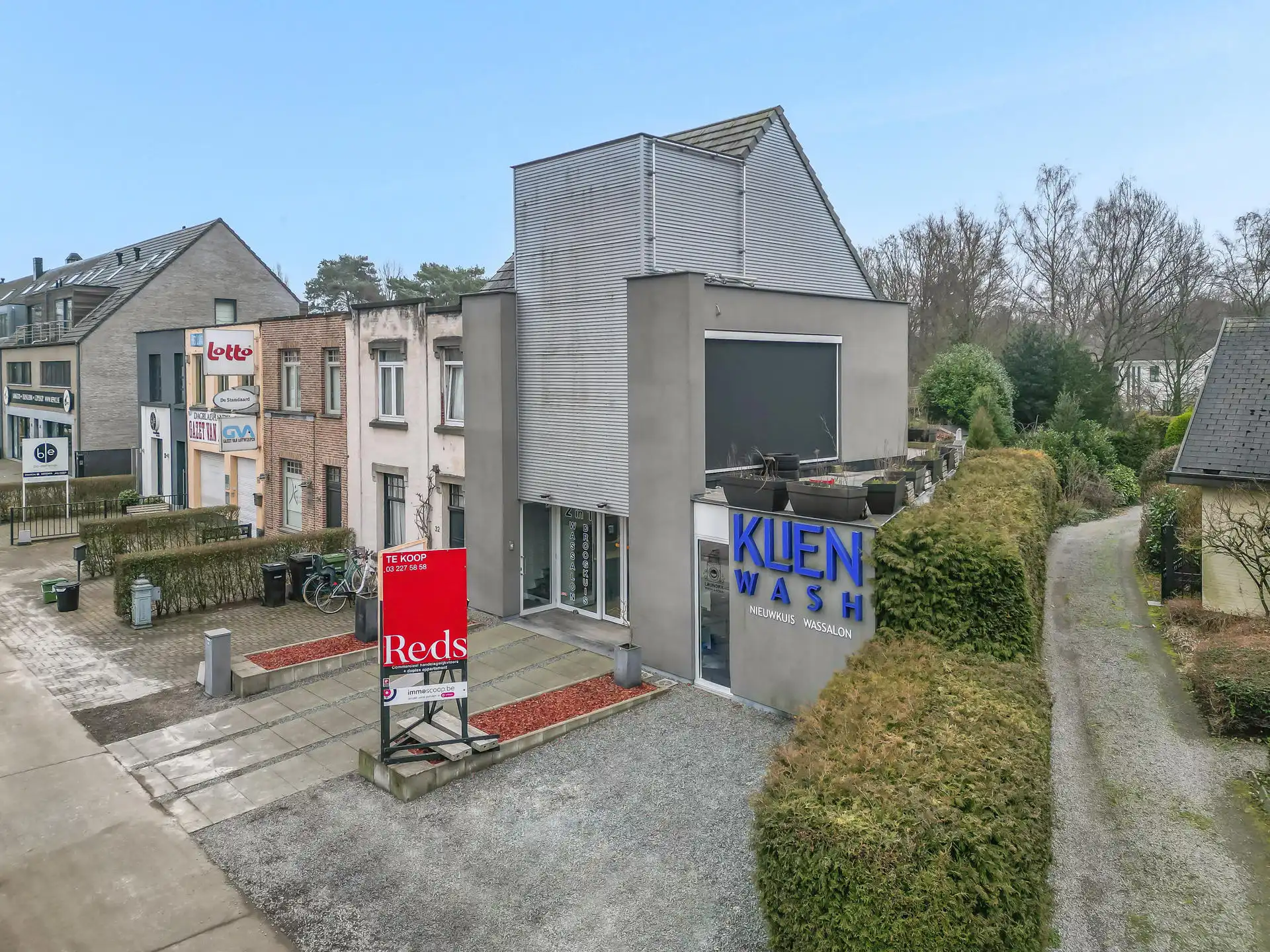 Modern gebouw met handelsgelijksvloers + duplex 1slpk app. foto 26