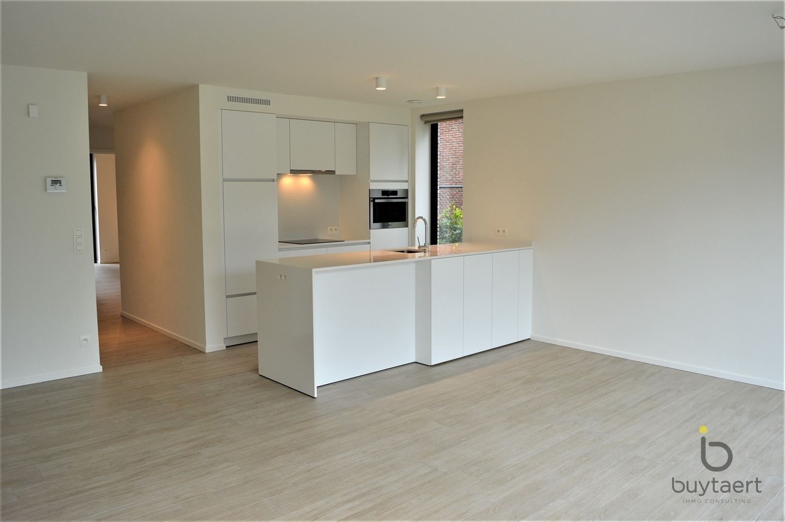 Gelijkvloers appartement met twee slpks en tuin! foto 7