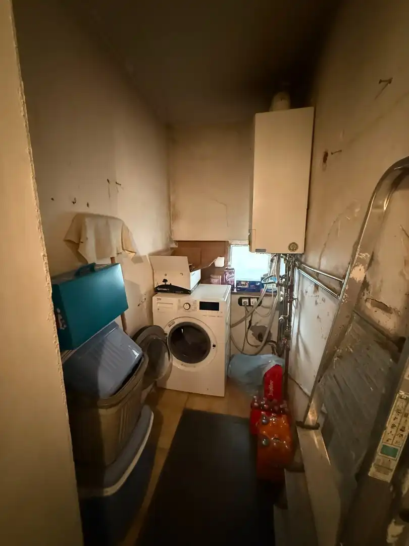 Opbrengsteigendom bestaande uit 2 halfopen woningen met garage en tuin te Hechtel. foto 6