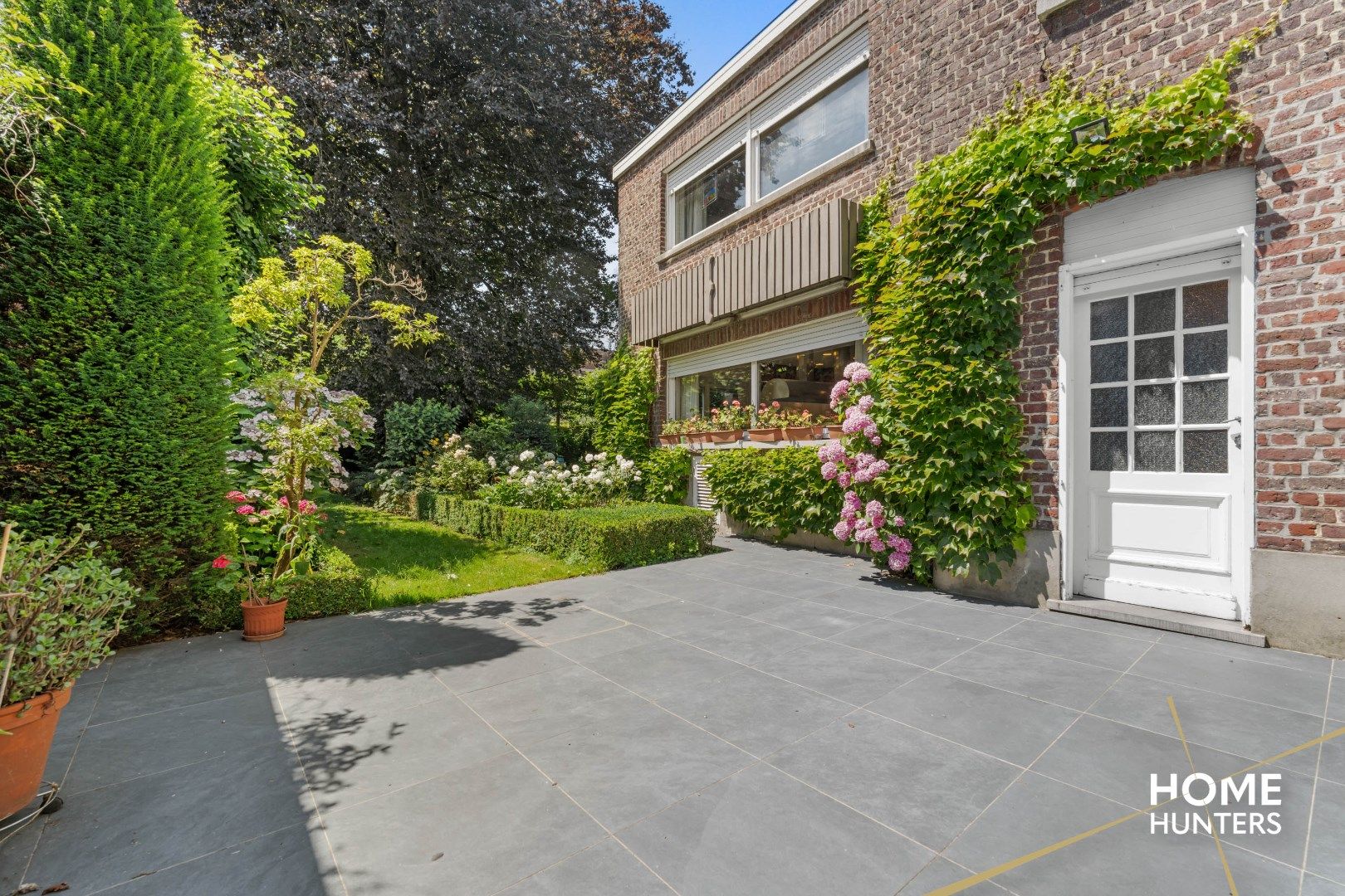 Statige herenwoning met 8 slaapkamers, ruime garage, praktijkruimte en fenomenale stadstuin foto 40