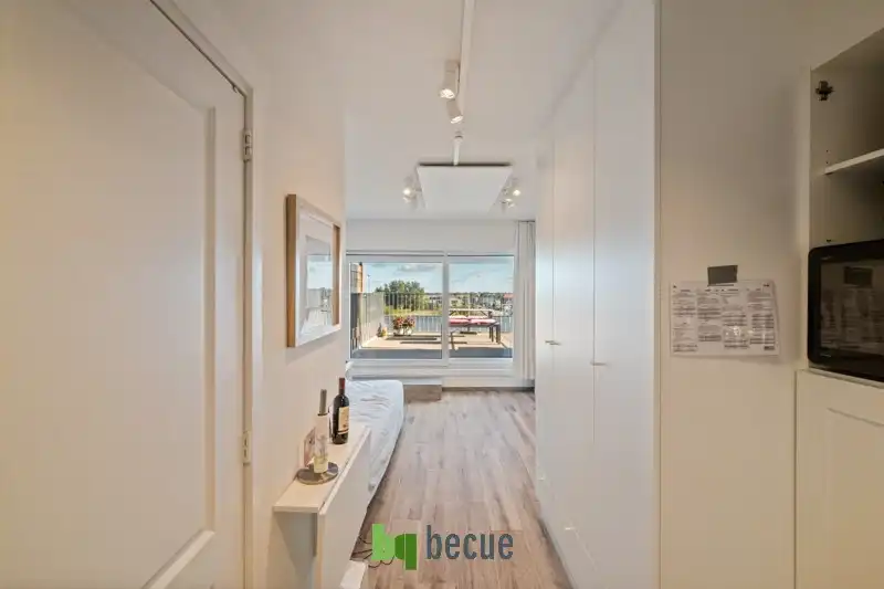 Studio met ruim zonnig terras van 16m², duinenzicht alsook zicht op de Rotonde en zee! foto 8