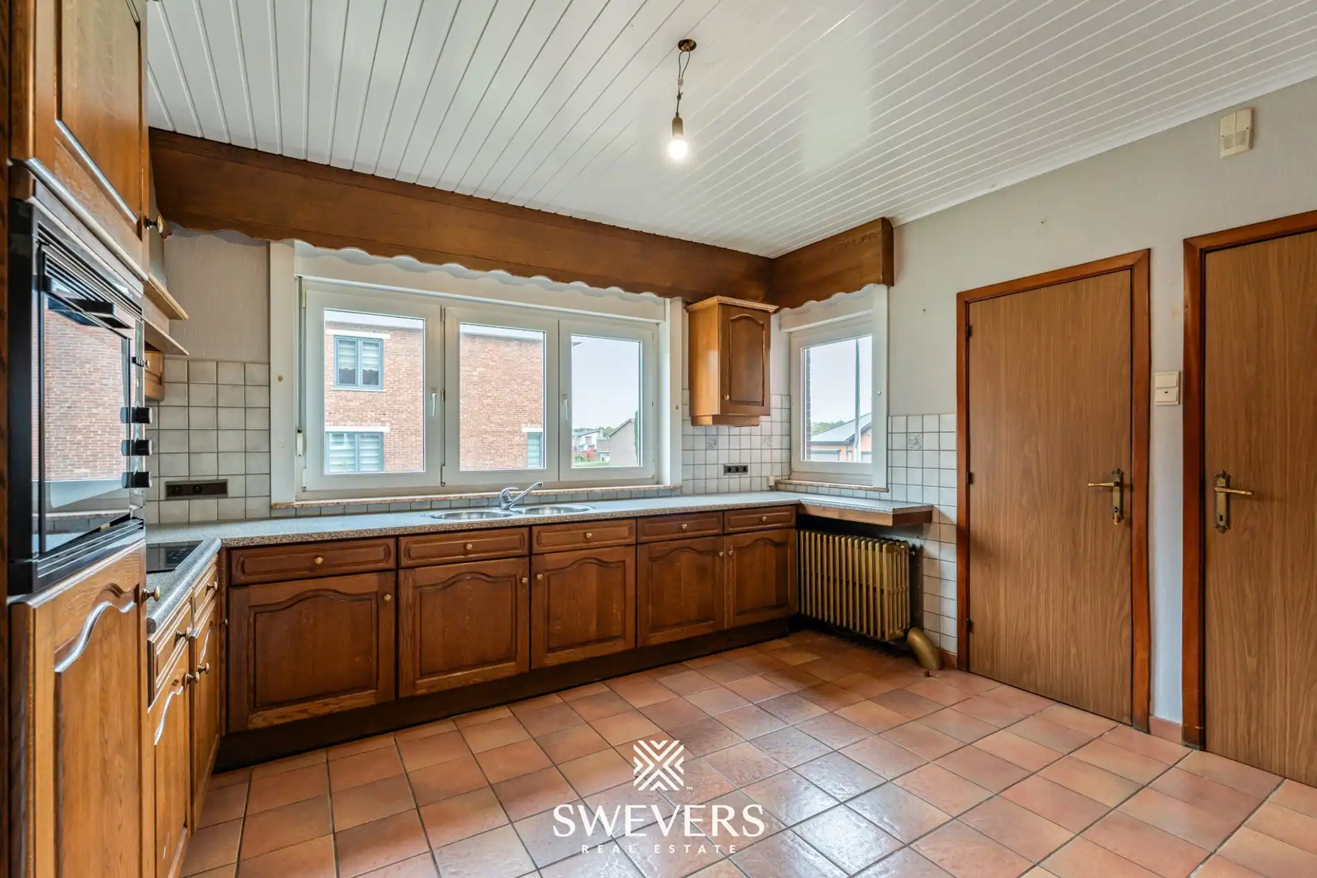 Ruime open bebouwing met potentieel en zuidgerichte tuin in rustige wijk van Houthalen foto 10