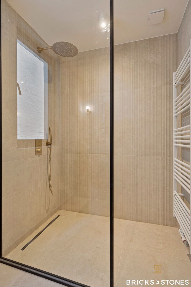Knap gerenoveerd gelijkvloers appartement met tuin foto 15
