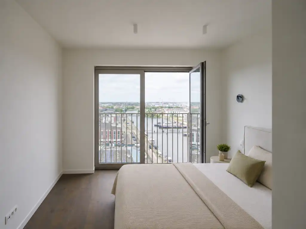 Penthouse met twee volwaardige slaapkamers en een uitzonderlijk terras met panoramisch zicht over Gent en zijn torens. foto 9