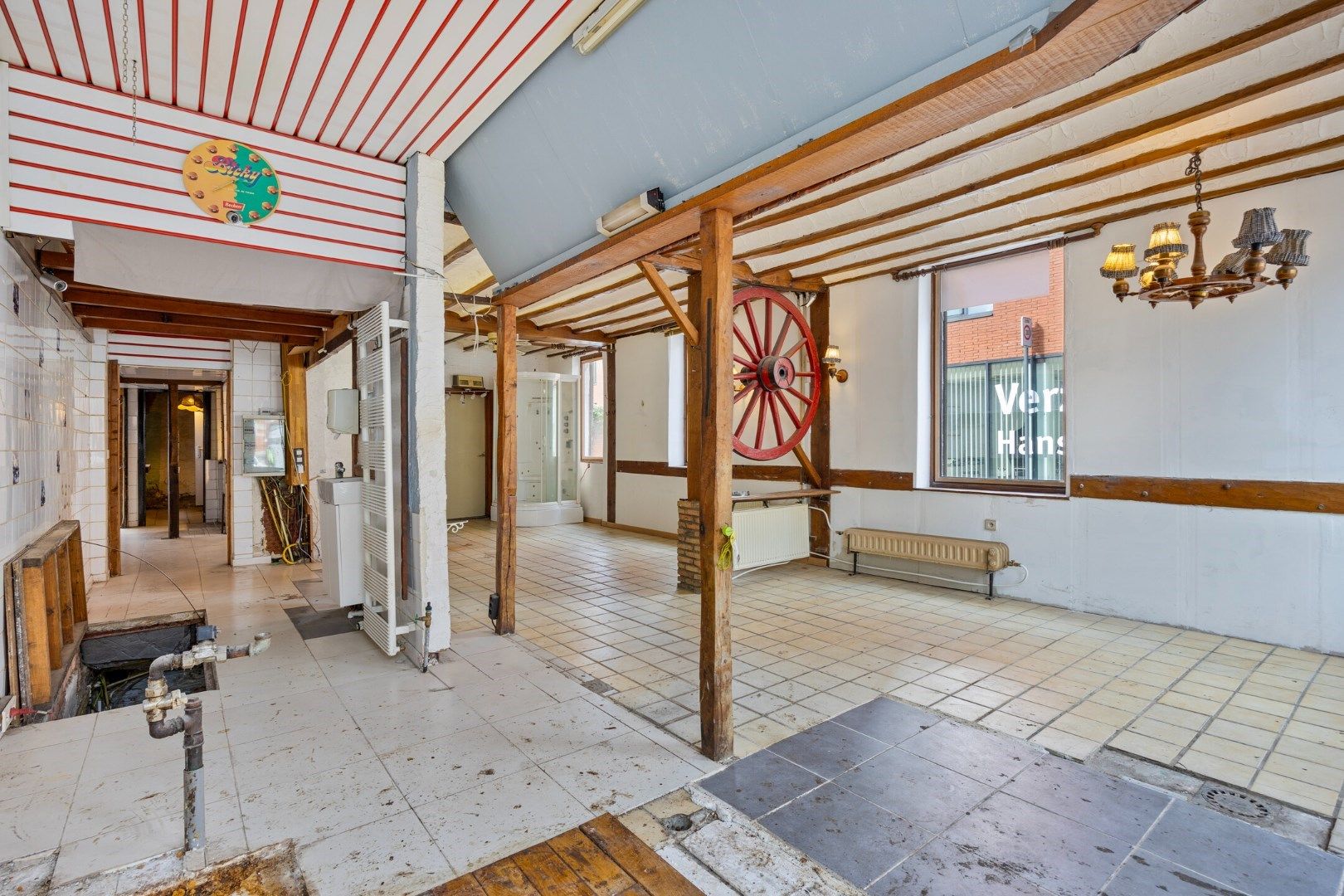Halfopen hoekwoning met garage en dakterras op toplocatie in Kessel-Lo – renovatieproject met veel potentieel foto 4