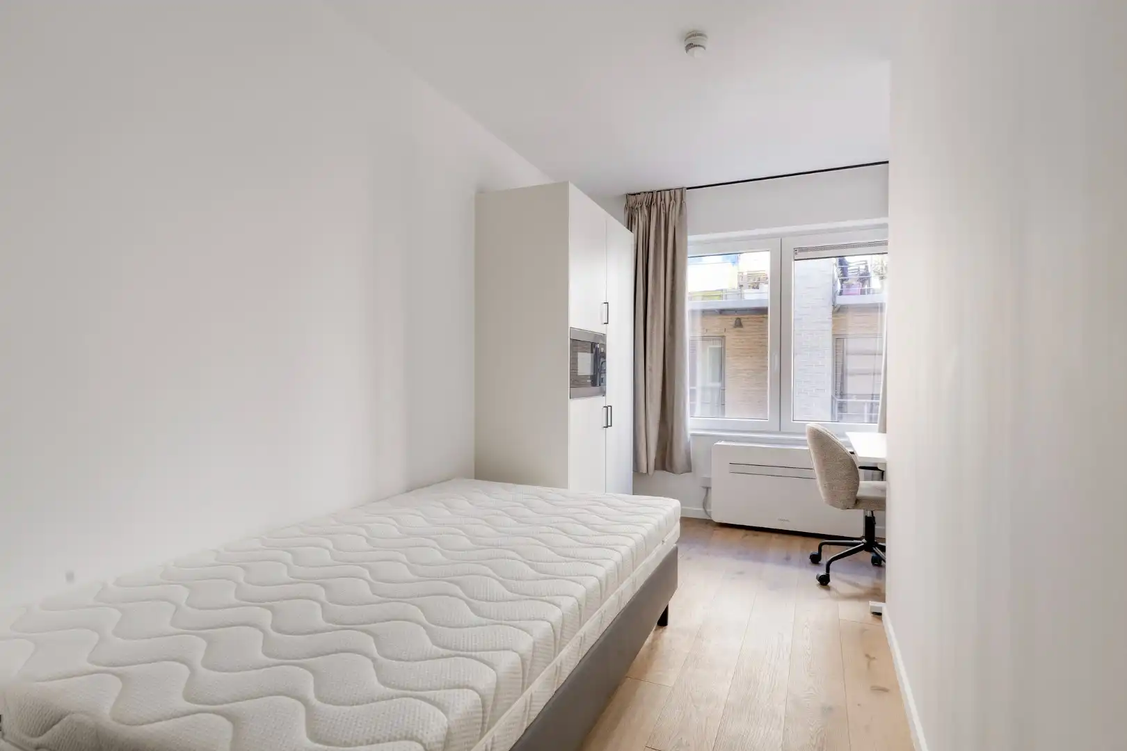 Volledig gerenoveerde studentenkamer in residentie met 15 studentenkamers en een 1slaapkamer appartement in hartje Leuven - EPC label A! foto 5