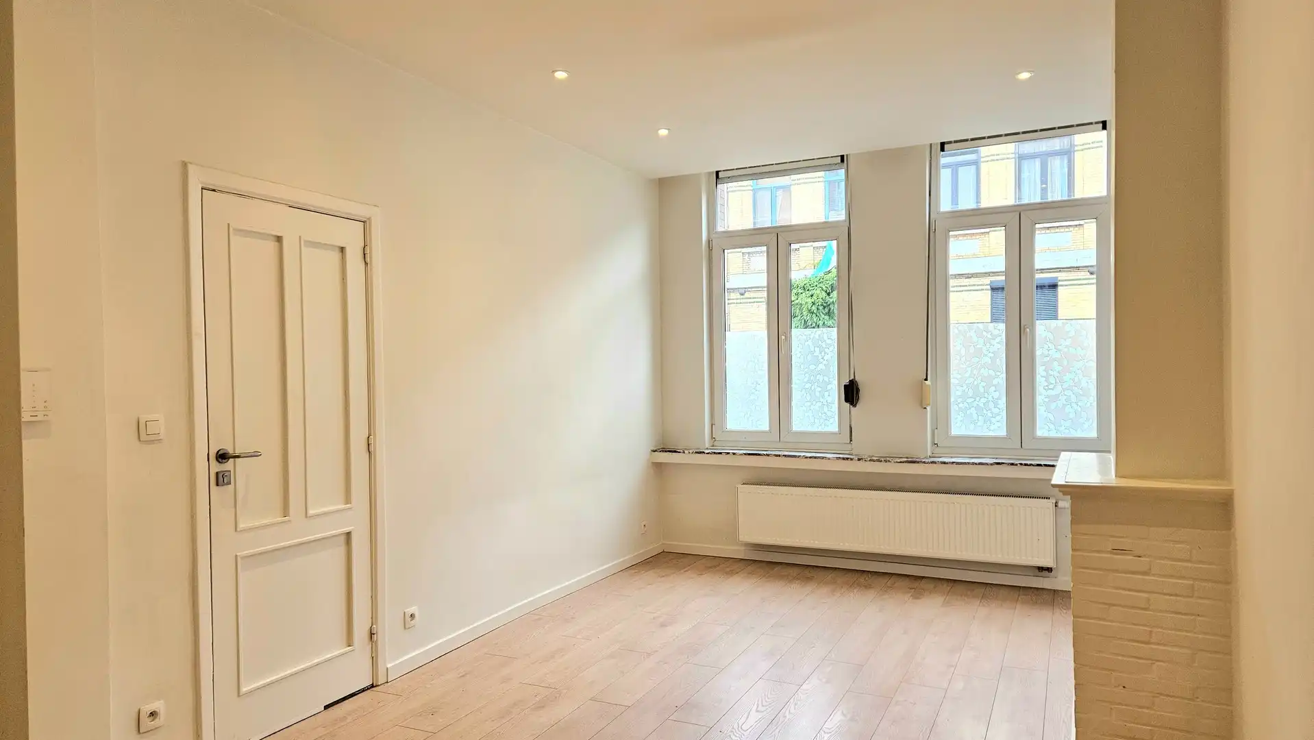 Appartement op het gelijkvloers met koer foto 2