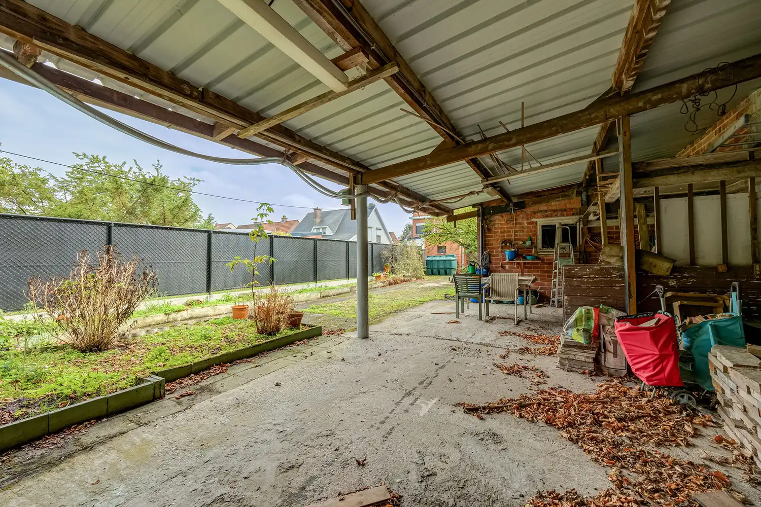 Halfopen woning op 575 m² met garage, carport en diepe tuin – te renoveren foto 15