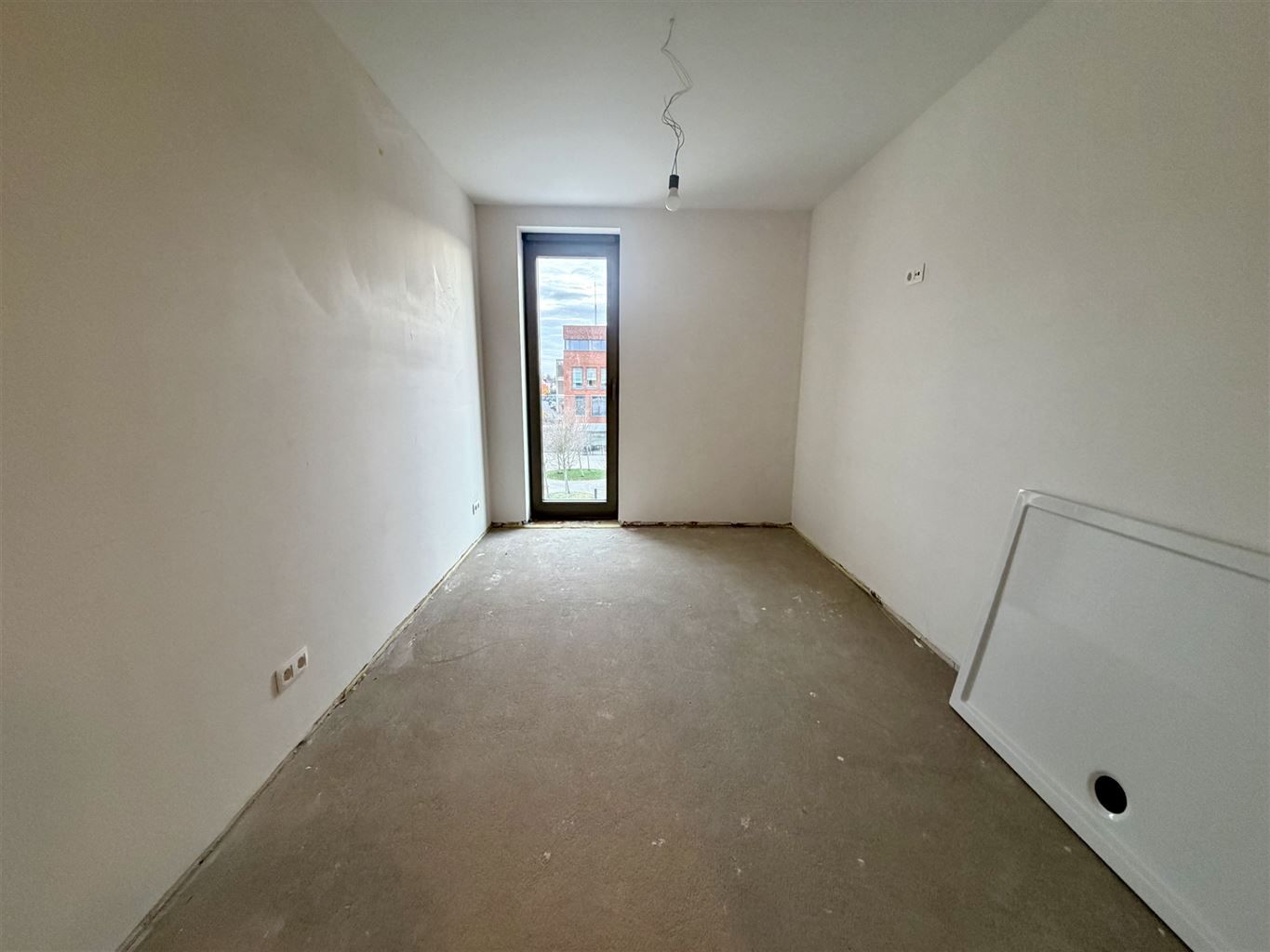 Nieuwbouwappartement op de tweede verdieping met 2 slaapkamers en terras gelegen in het centrum van Dilsen.  foto 7