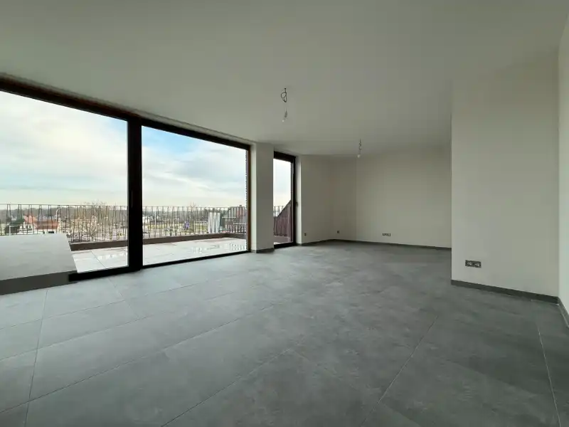 Prachtig BEN-penthouse met 1 slpk, terras, parking én zonnepanelen in het centrum van Houthalen foto 3