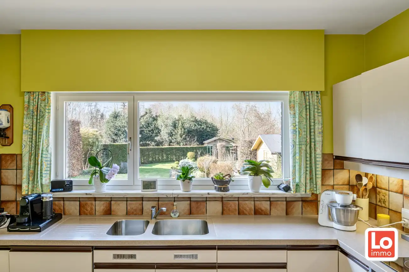 Degelijke open gelijkvloerse woning met inpandige garage en grote tuin op een groene toplocatie in Beervelde! foto 17