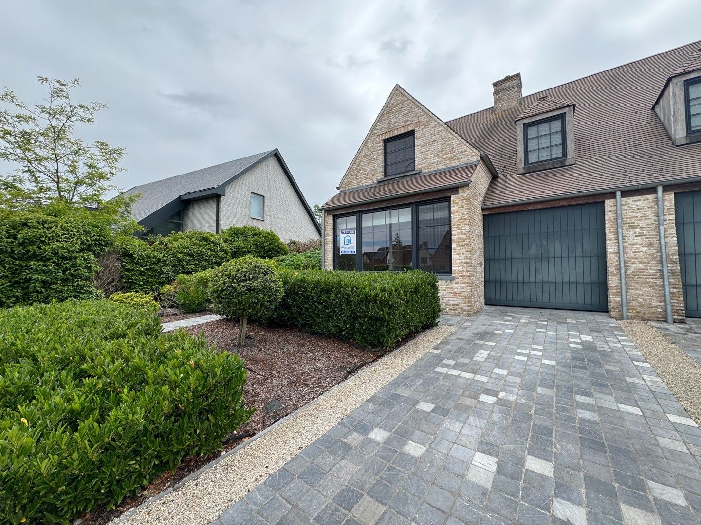 Mooie halfopen gezinswoning met zicht op Ename bos foto 2