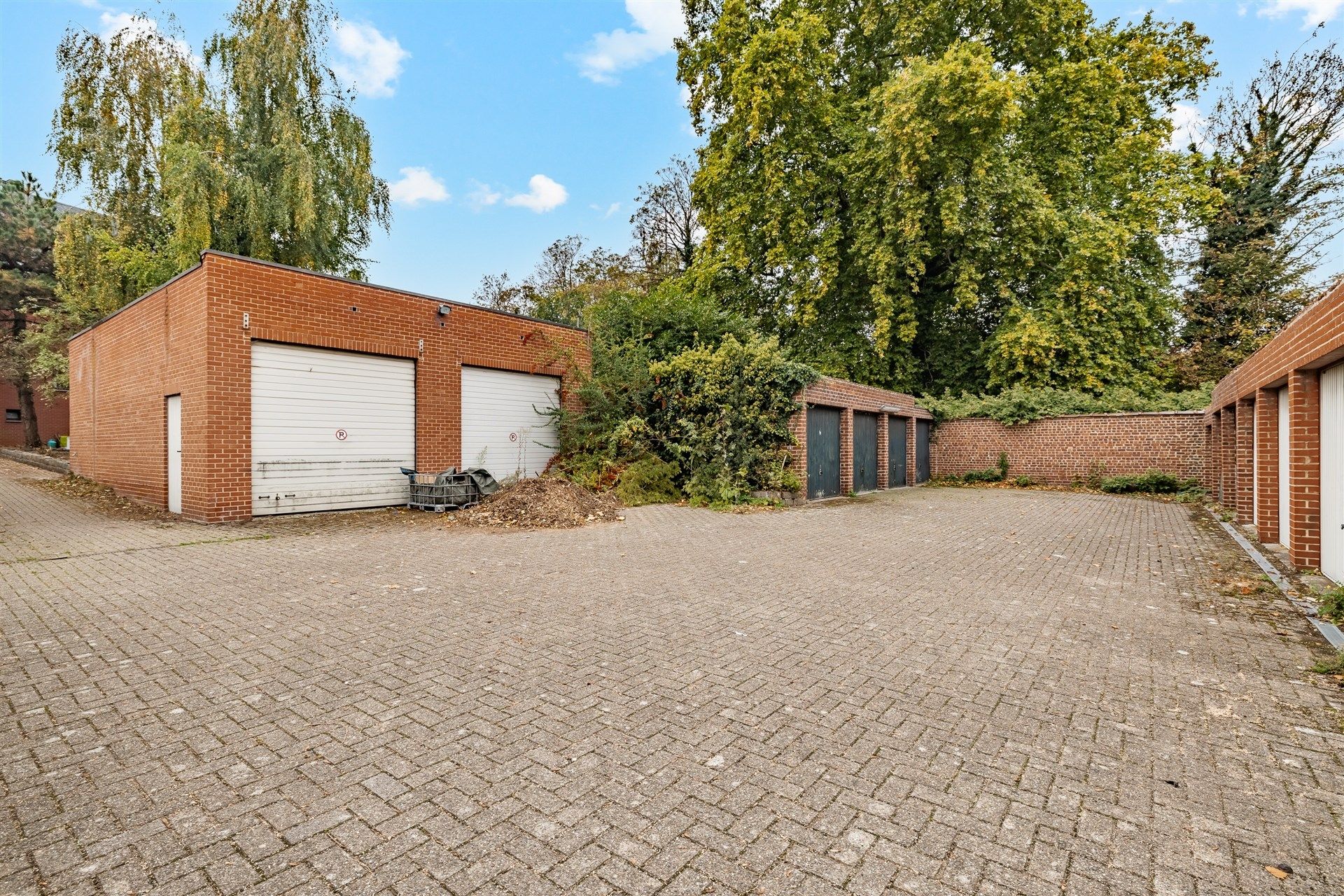 Opbrengsteigendom bestaande uit 4 appartementen + 22 garageboxen + magazijn/werkplaats foto 22