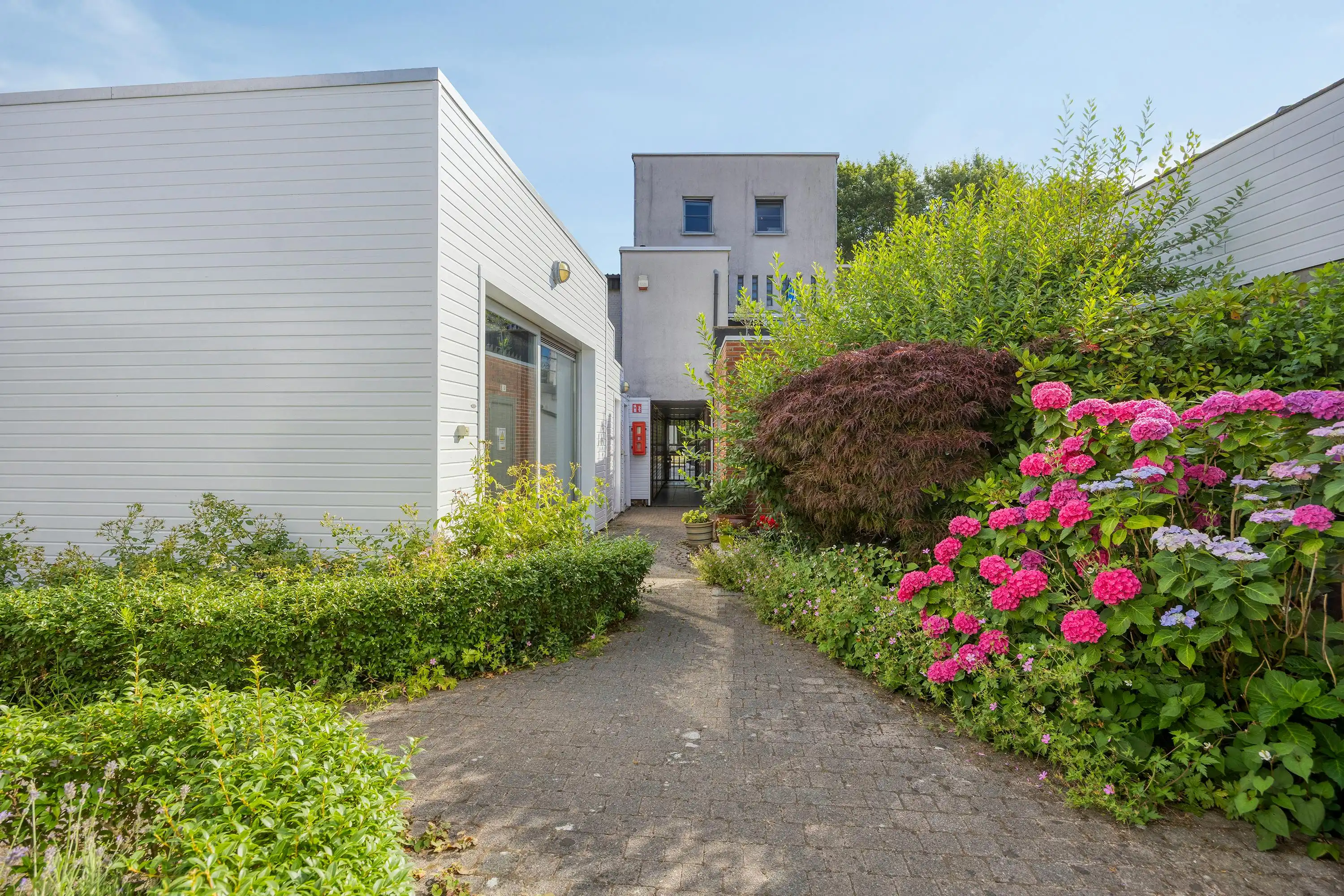 Instapklaar gelijkvloers appartement met gemeenschappelijke tuin en fietsenberging in hartje Kapellen! foto 15