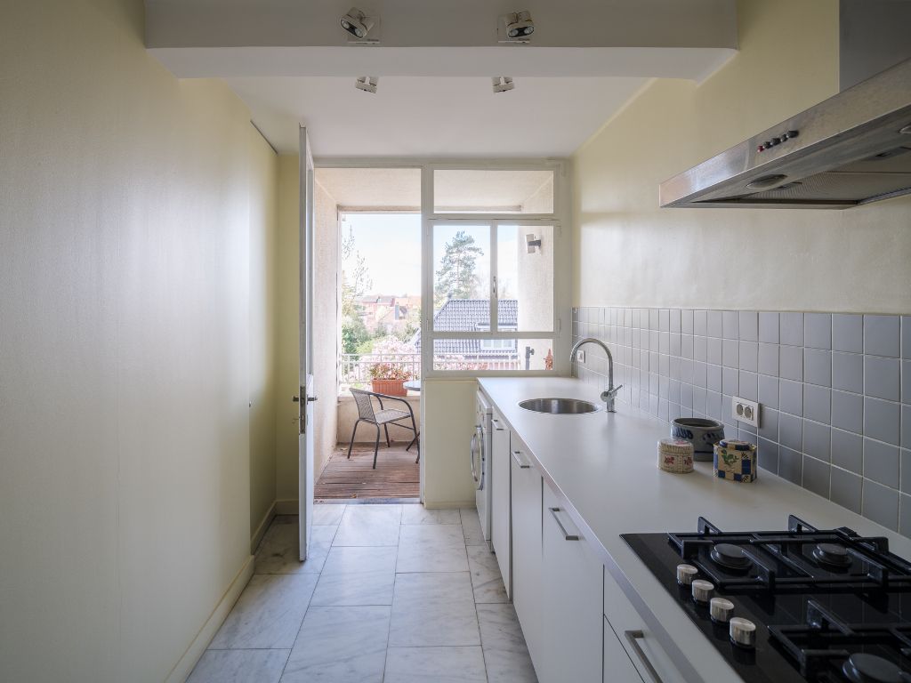Lichtrijk appartement met 2 volwaardige slaapkamers, inpandig terras en gemeenschappelijke tuin, in een residentiële straat nabij het station Gent-Sint-Pieters. foto 5