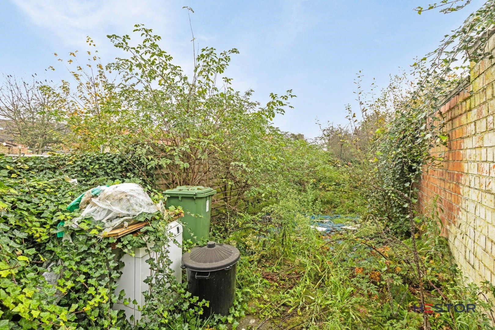 Op te frissen woning, met tuin in Temse foto 12