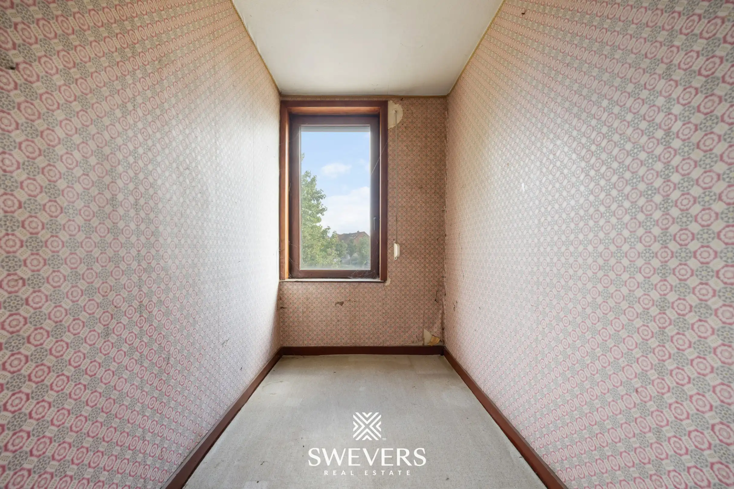 Renovatieproject met veel potentieel: karaktervolle rijwoning met tuin in de Banneuxwijk foto 17
