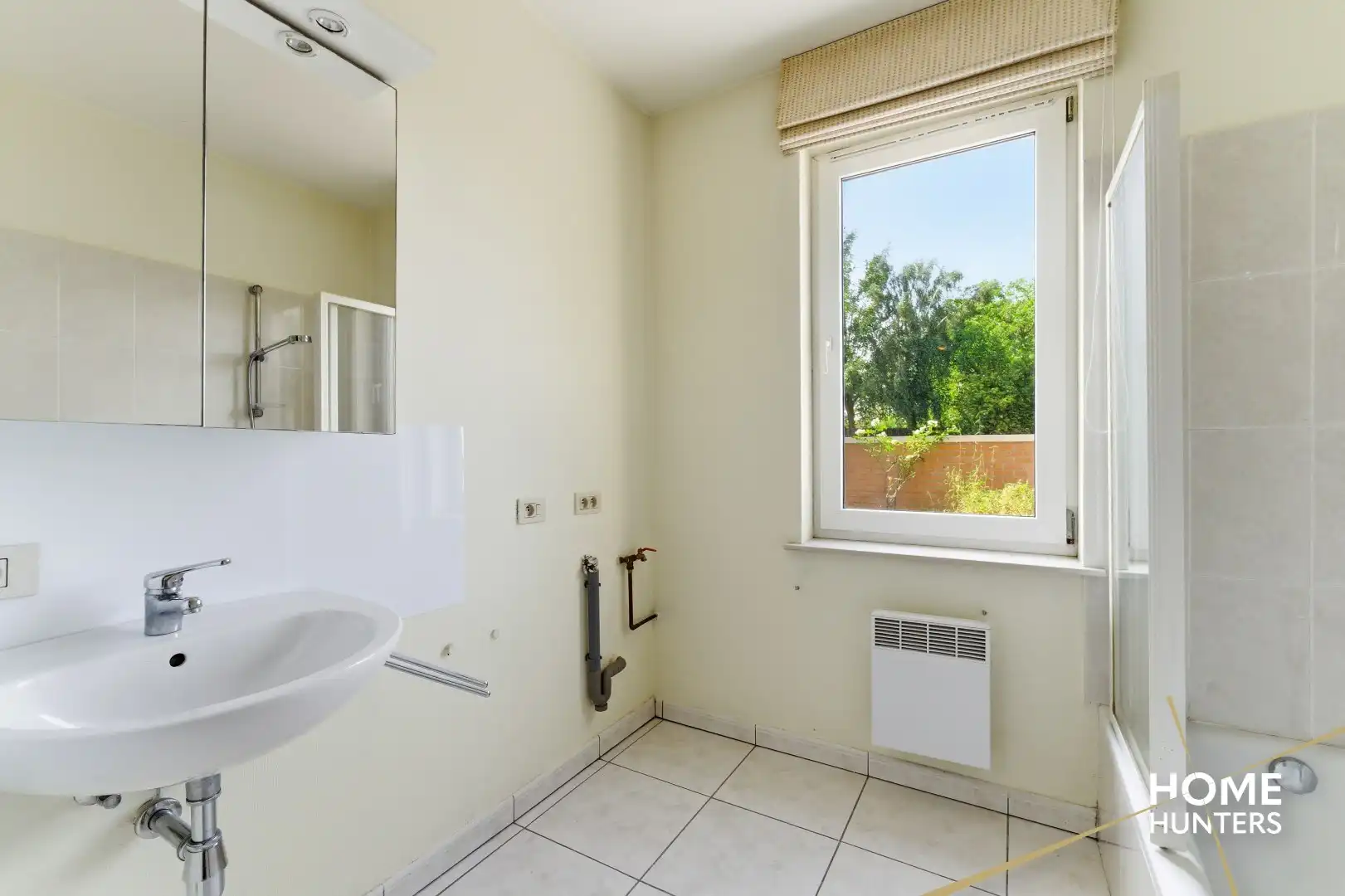 Instapklaar gelijkvloers appartement met 2 slaapkamers en ruime tuin foto 21