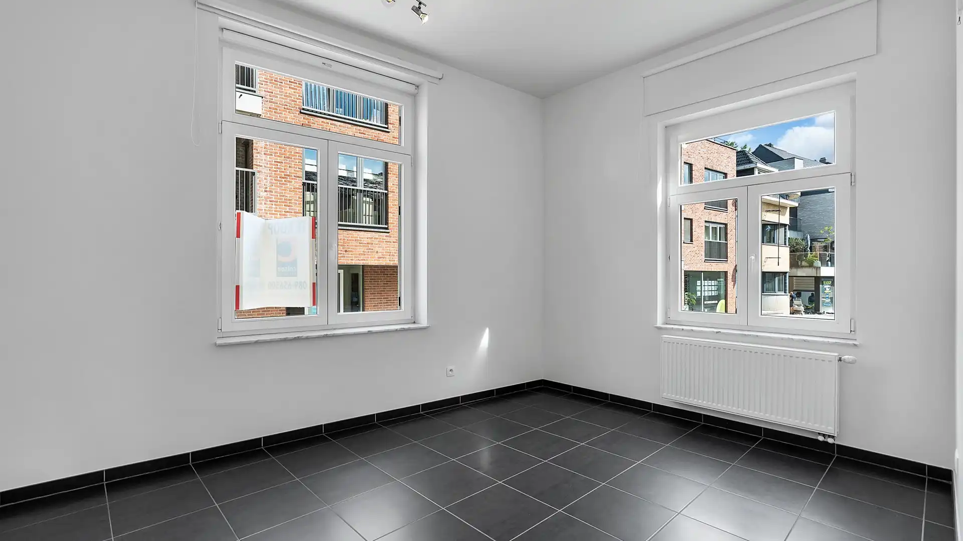 Gelijkvloers appartement met terras en private parking. Uitstekende ligging aan de vernieuwde Markt. foto 16