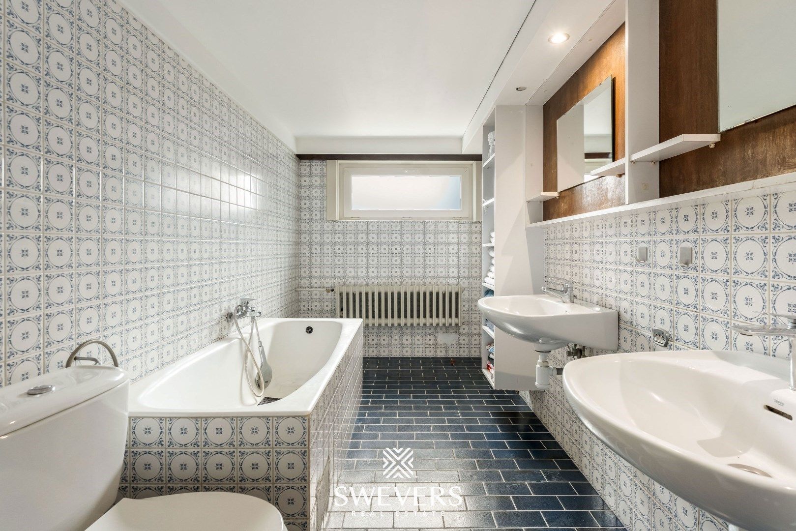 Gezinswoning met verrassend veel ruimte: vijf slaapkamers, kelderverdieping en loods foto 17