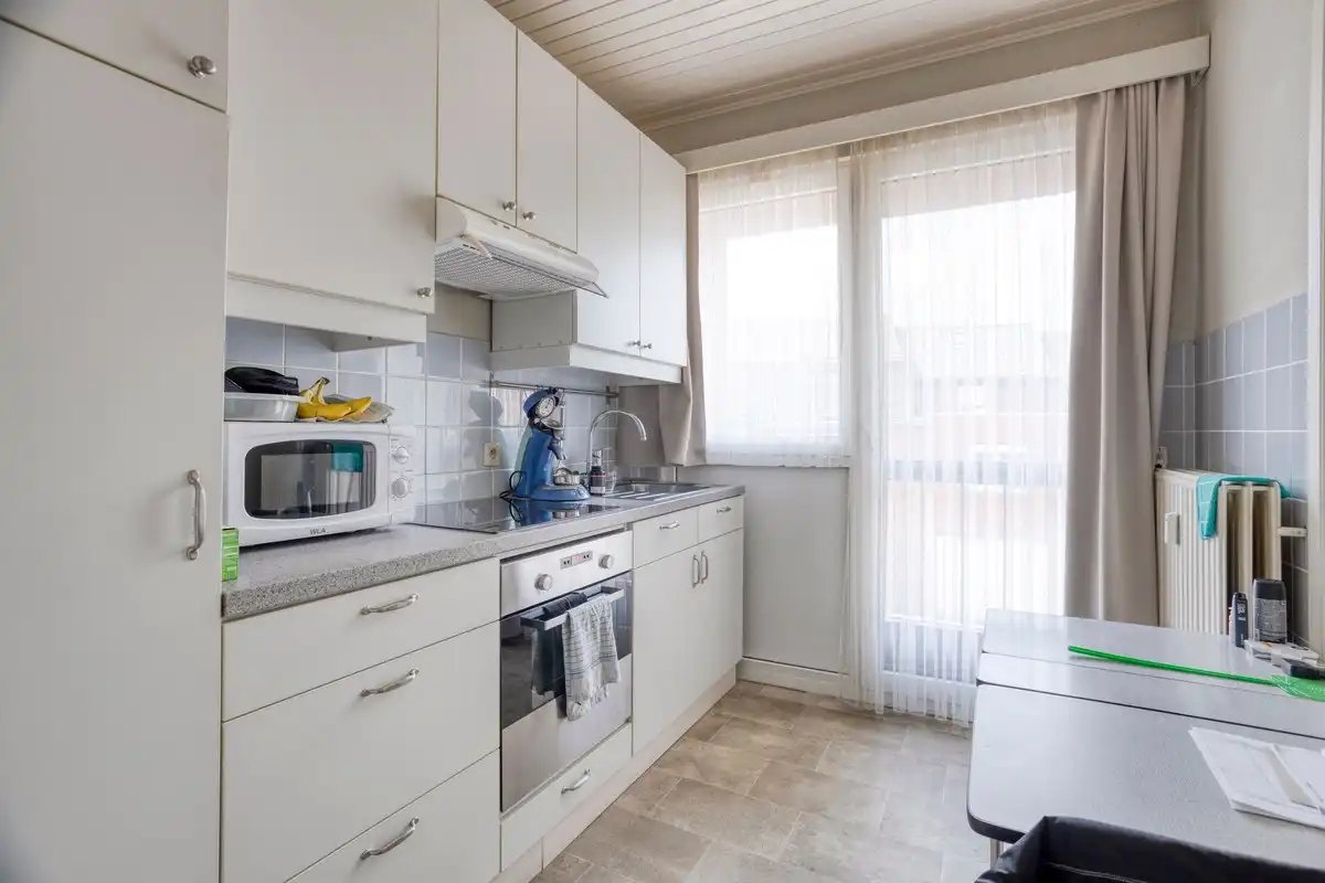 Opbrengsteigendom met 3 appartementen, garages en tuin foto 15