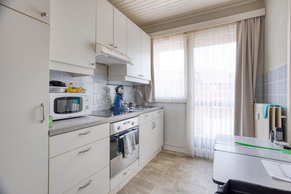 Opbrengsteigendom met 3 appartementen, garages en tuin foto 15