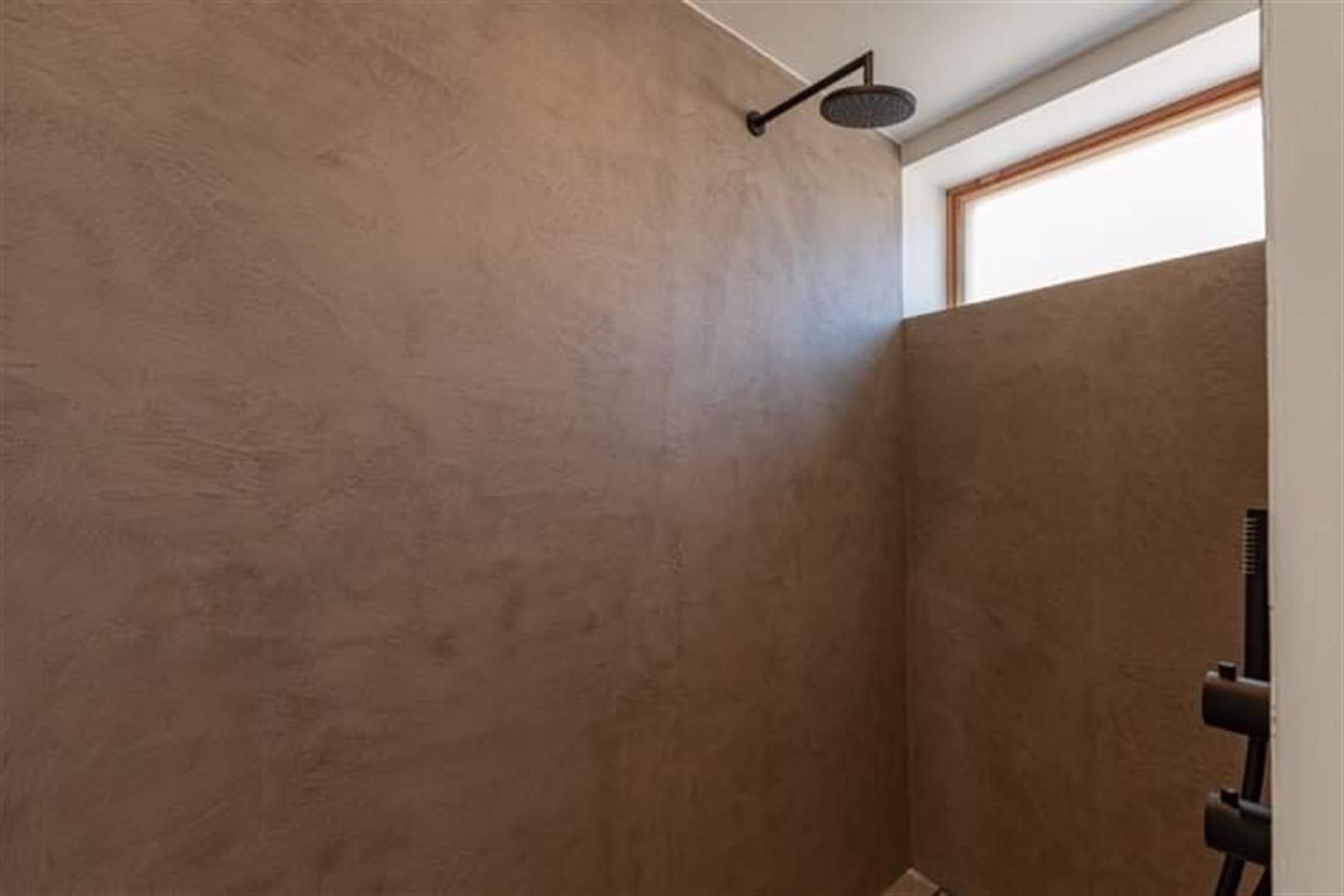 Karaktervol gelijkvloers  appartement met patio en terras foto 18