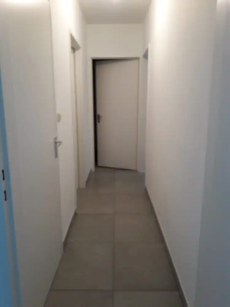 Volledig gerenoveerd gelijkvloers appartement met terras, berging en afgesloten garage foto 5
