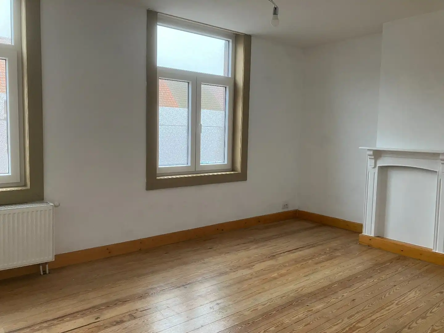 Rijwoning met 2 slaapkamers en achterliggende garage! foto 7