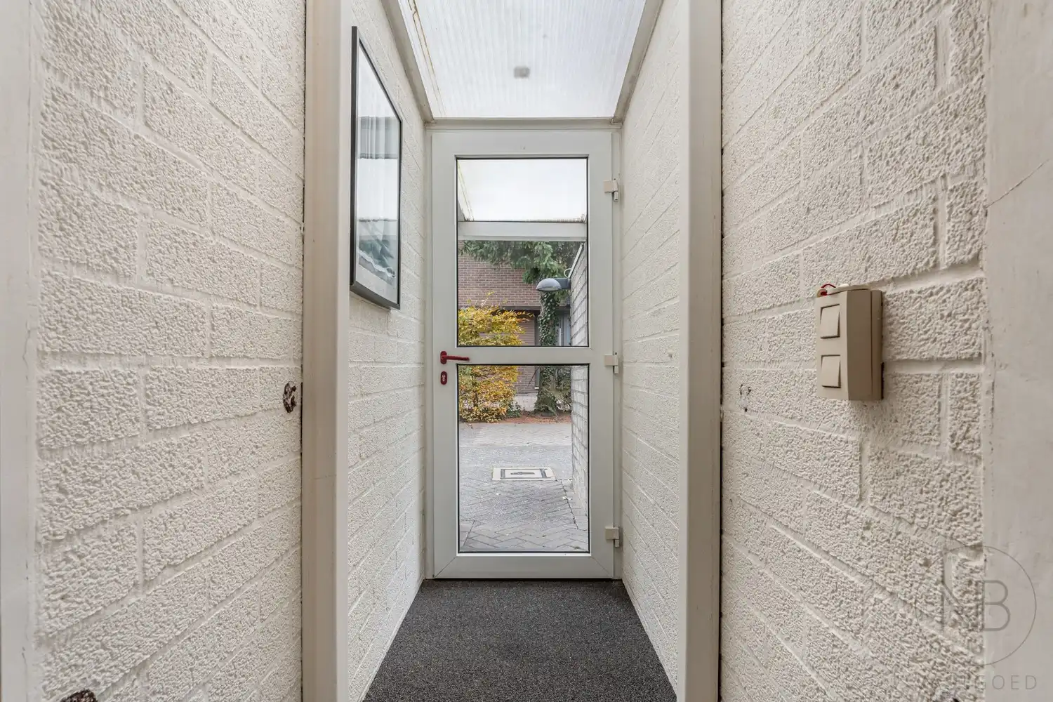 Pand met vergunde praktijkruimte, woonst, garage en carport in Opglabbeek foto 10