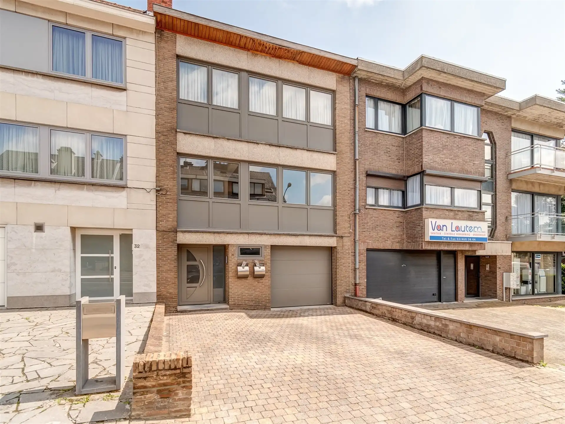 Opbrengsteigendom met twee appartementen, tuin en garage in Wemmel foto {{pictureIndex}}