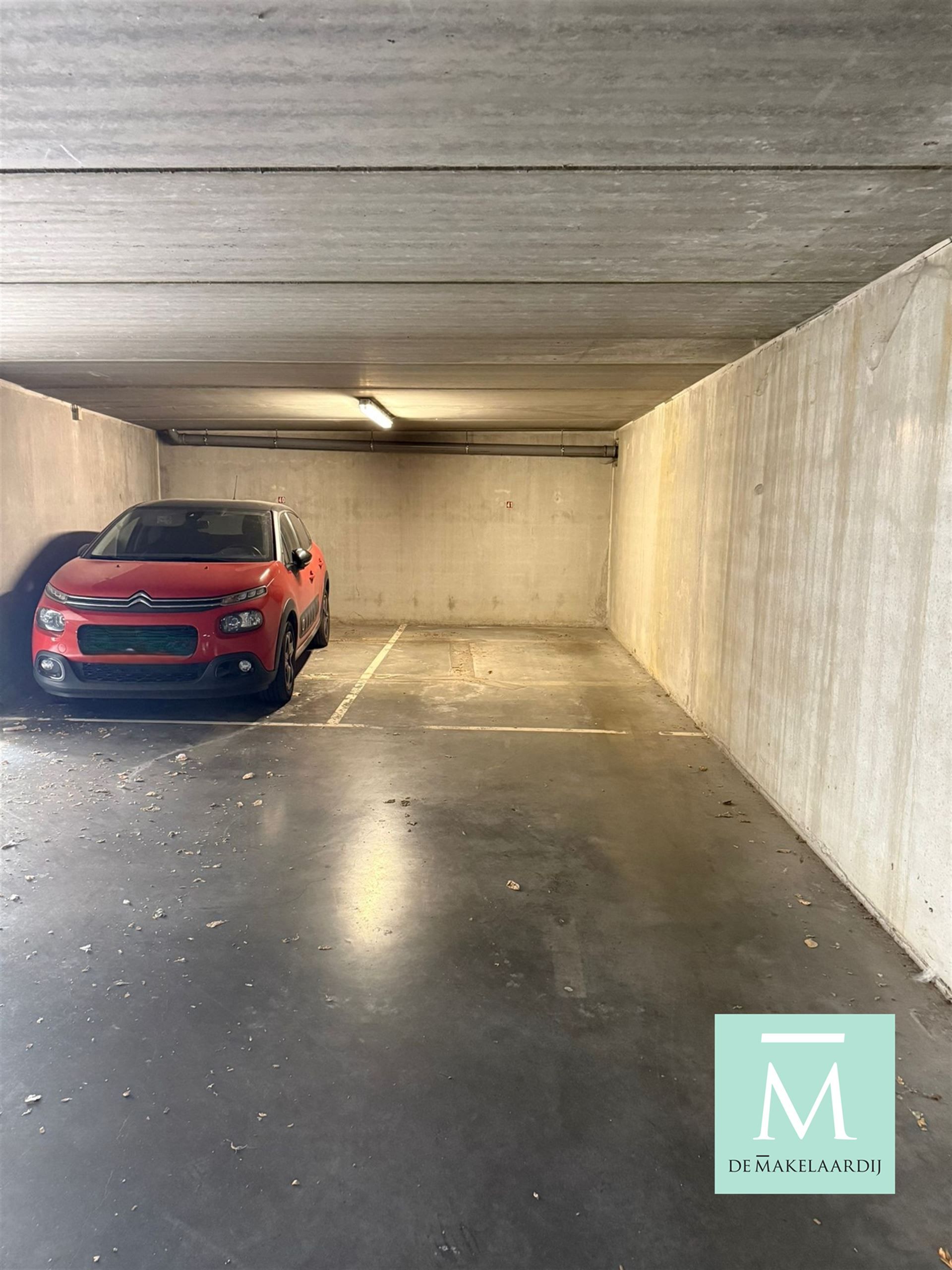 Ondergrondse autostaanplaats te huur in Mechelen nabij de Dijle! foto {{pictureIndex}}