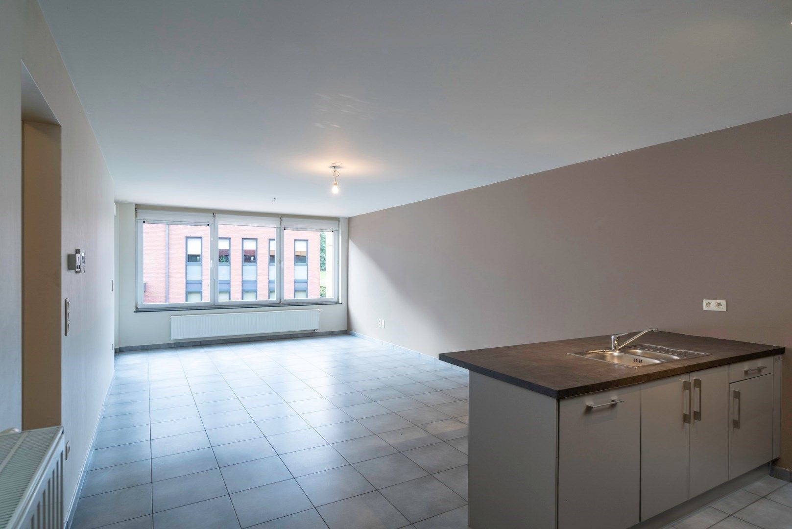 Comfortabel, recent appartement met 2 slaapkamers, garage en kelderberging op wandelafstand van markt Bilzen + park Haffmans foto 3