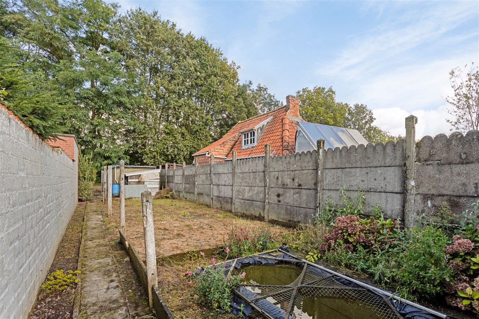 Te renoveren woning met tuin en toegang achteraan. foto 28