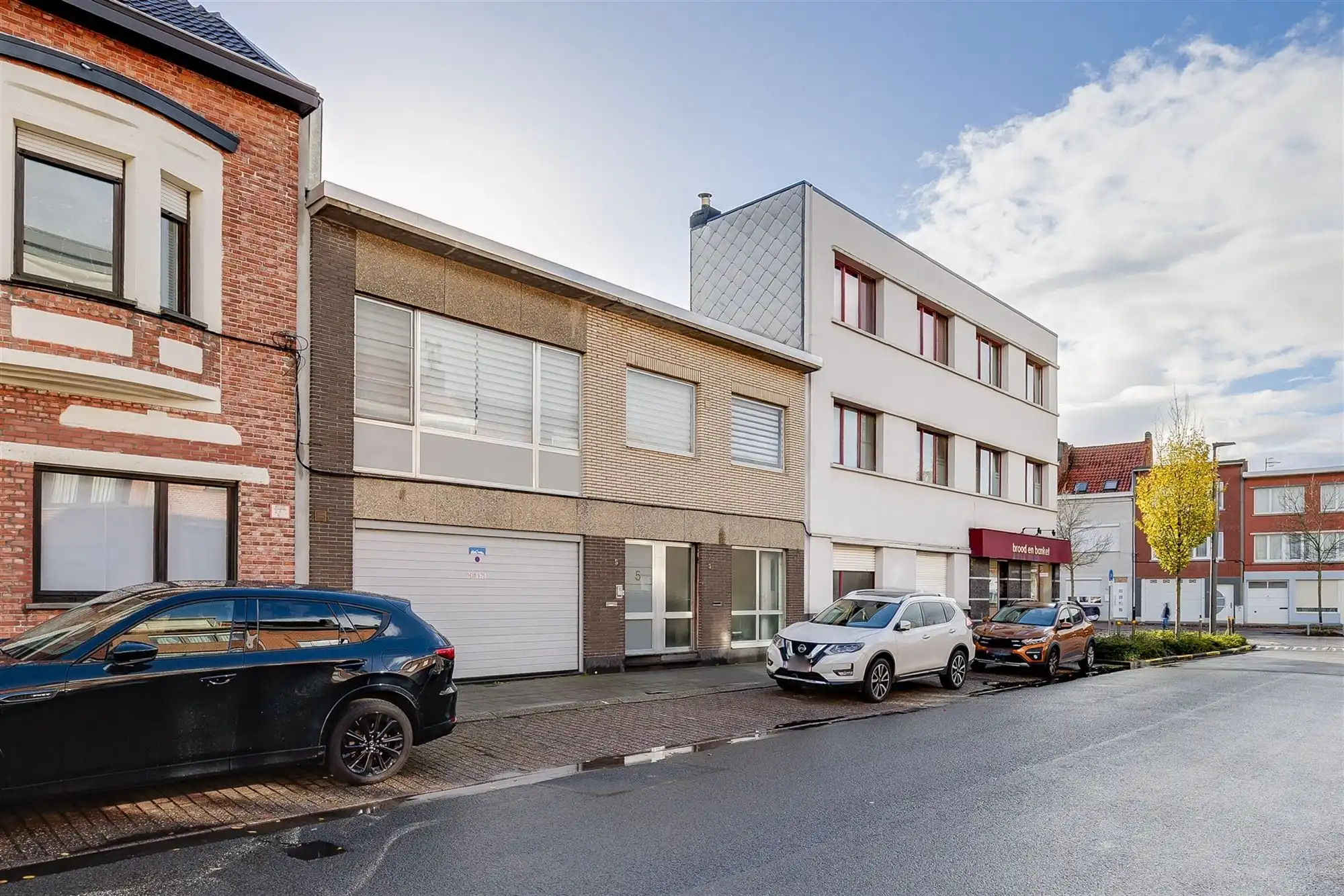 Uniek hoekperceel met handelshuis + garage + appt foto 2